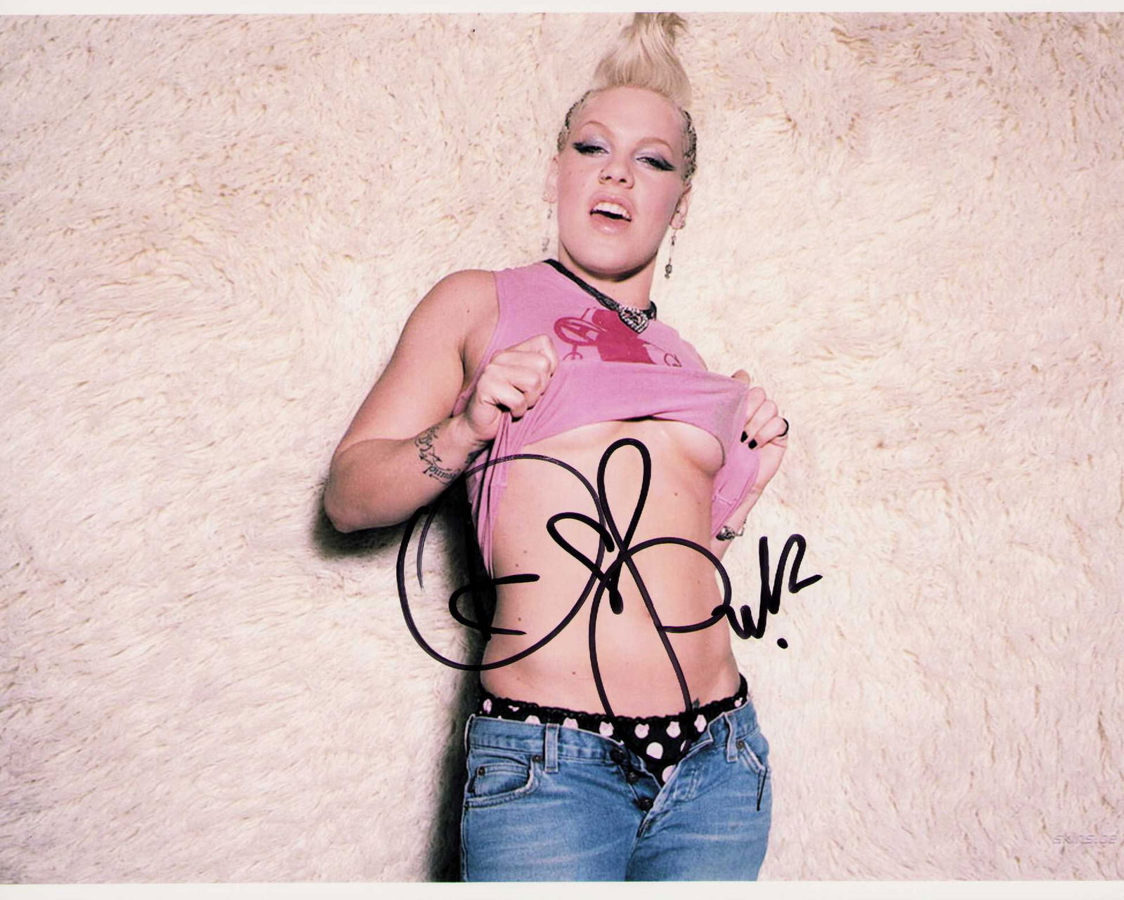 Pink signed photograph: Signed by scarce signing pop star Certificate of AuthenticityEVERY item in this auction comes with at minimum one fully illustrated and serial numbered COA signed by the worlds leading authenticator i