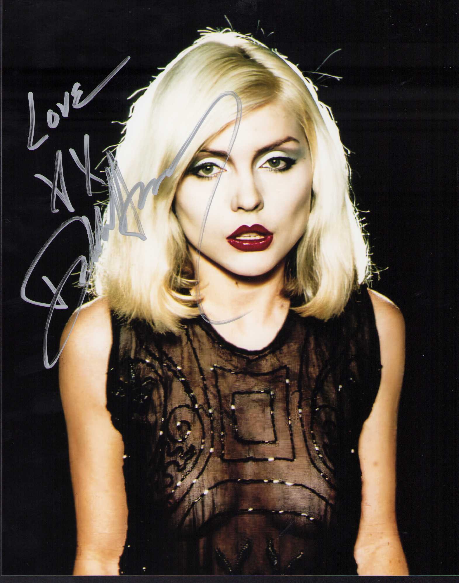 Debbie Harry signed photograph: A sexy in see thru top signed 8x10 of singer aka Blondie Certificate of AuthenticityEVERY item in this auction comes with at minimum one fully illustrated and serial numbered COA signed by the worlds