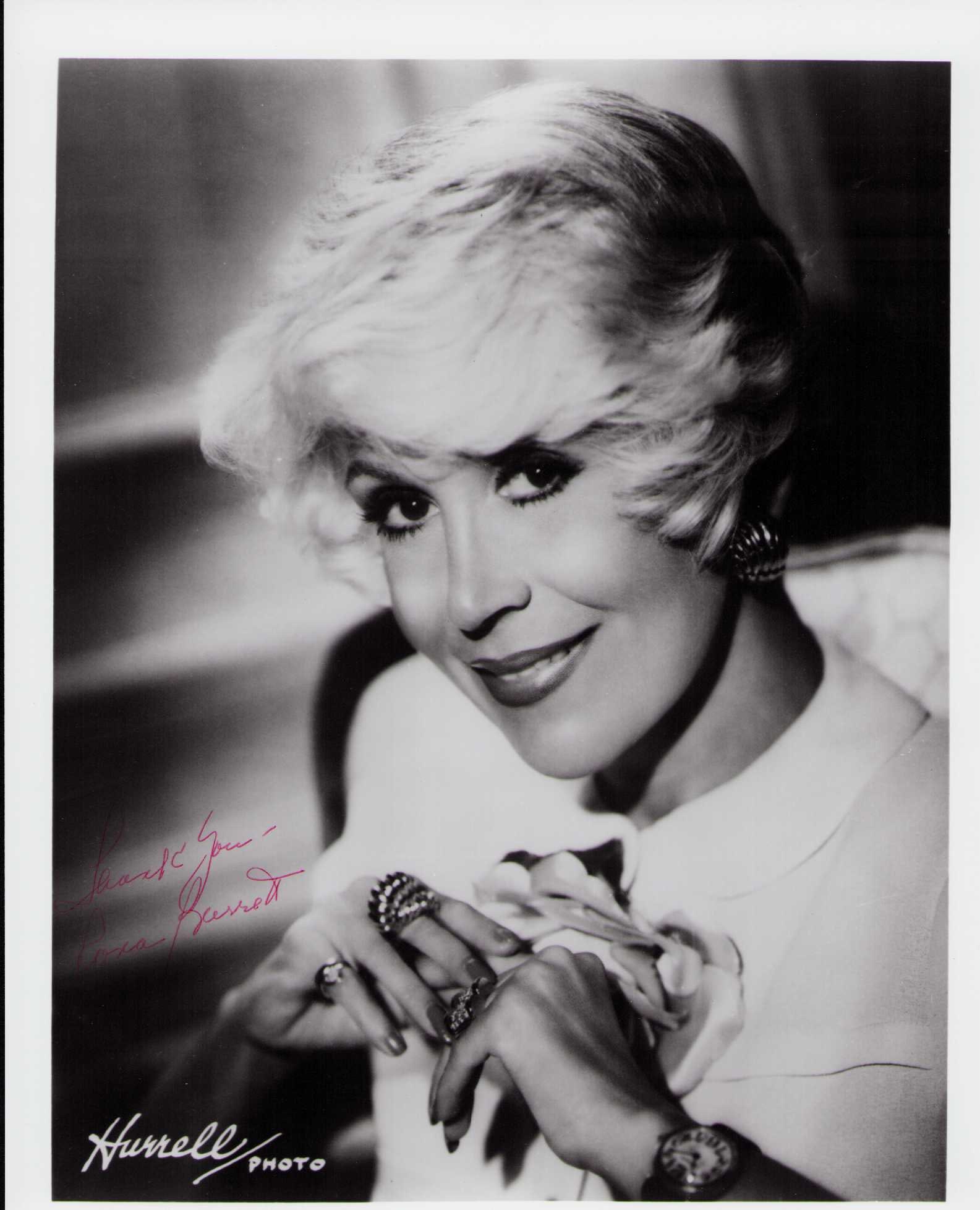 Rona Barrett signed photograph: A vintage signed 8x10 by the famed gossip columnist Certificate of AuthenticityEVERY item in this auction comes with at minimum one fully illustrated and serial numbered COA signed by the worlds leadi