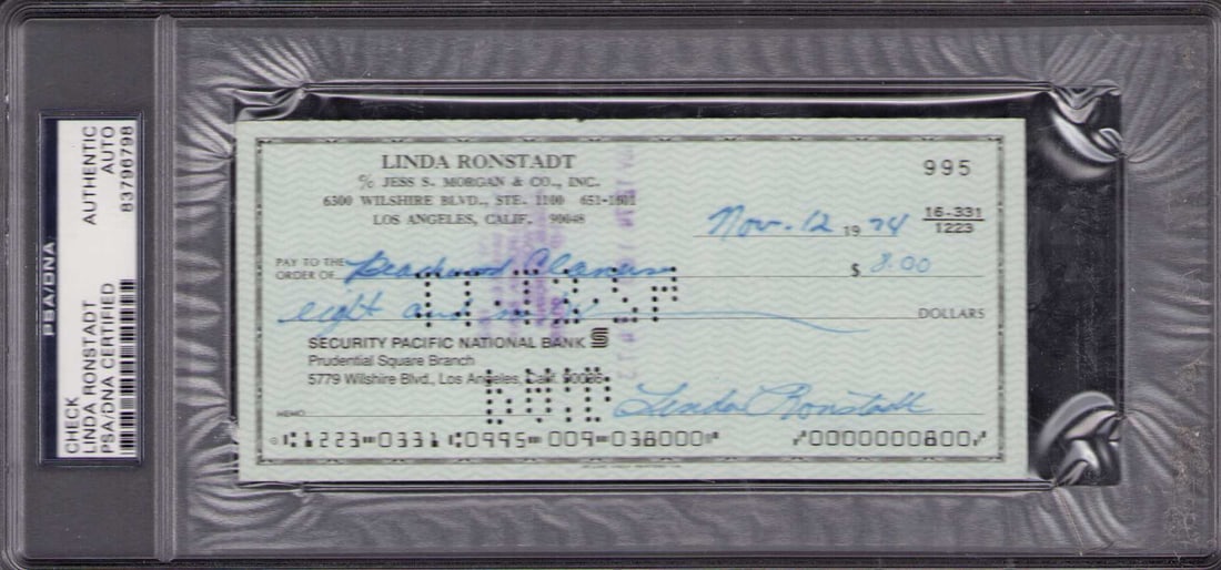 Linda Ronstadt bank check signed PSA DNA slabbed: A PSA DNA slabbed signed bank check by the rock legend herself Linda Ronstadt Certificate of AuthenticityEVERY item in this auction comes with at minimum one fully illustrated and serial numbered