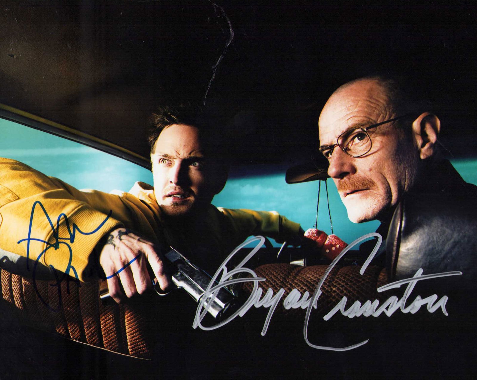 Breaking Bad cast signed photograph: Aaron Paul and Bryan Cranston signed from the famed Tv series Certificate of AuthenticityEVERY item in this auction comes with at minimum one fully illustrated and serial numbered COA signed by the