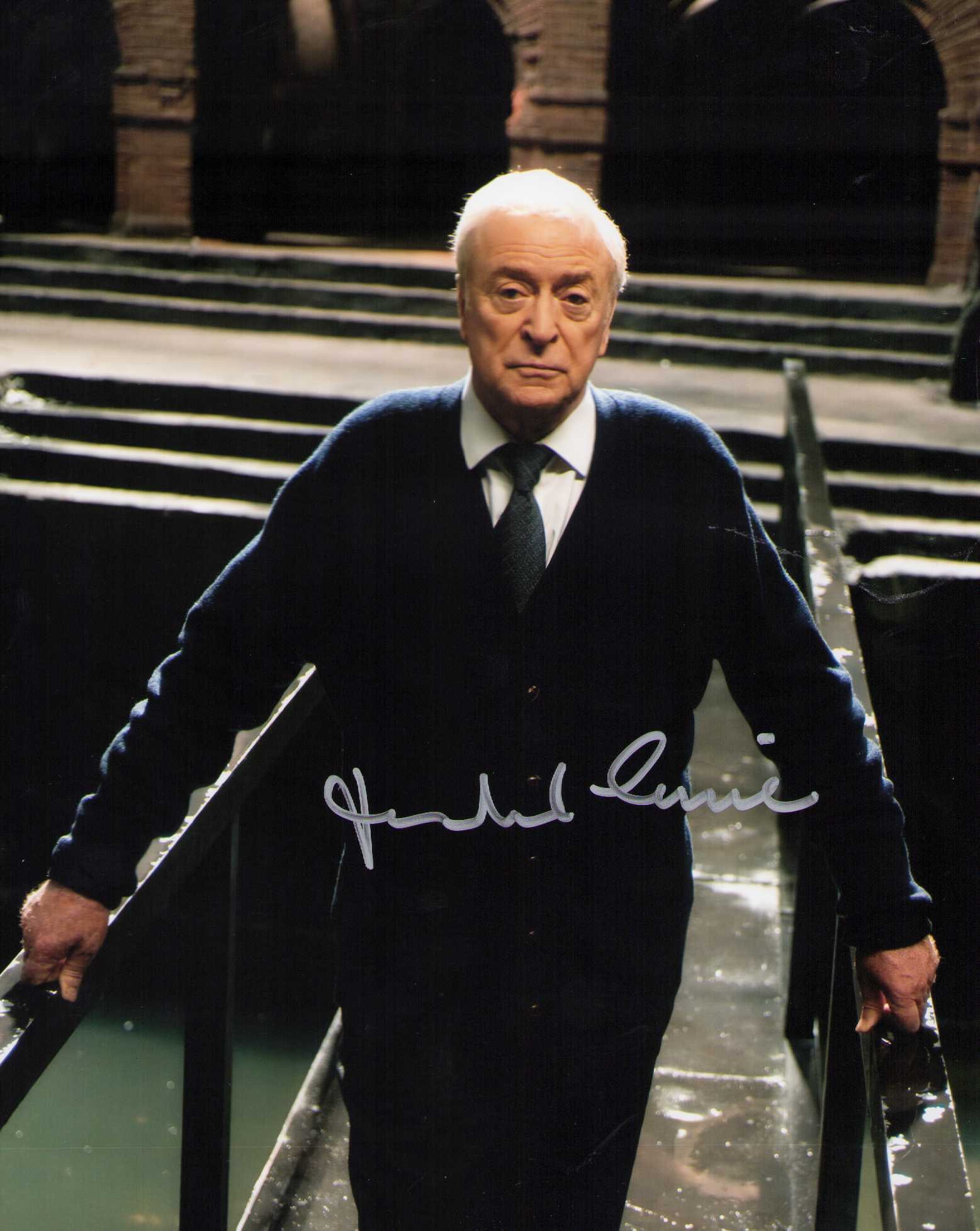 Michael Caine signed Batman photograph: A scarce signed 8x10 as Alfred the Butler to Batman in the movies Certificate of AuthenticityEVERY item in this auction comes with at minimum one fully illustrated and serial numbered COA signed by th