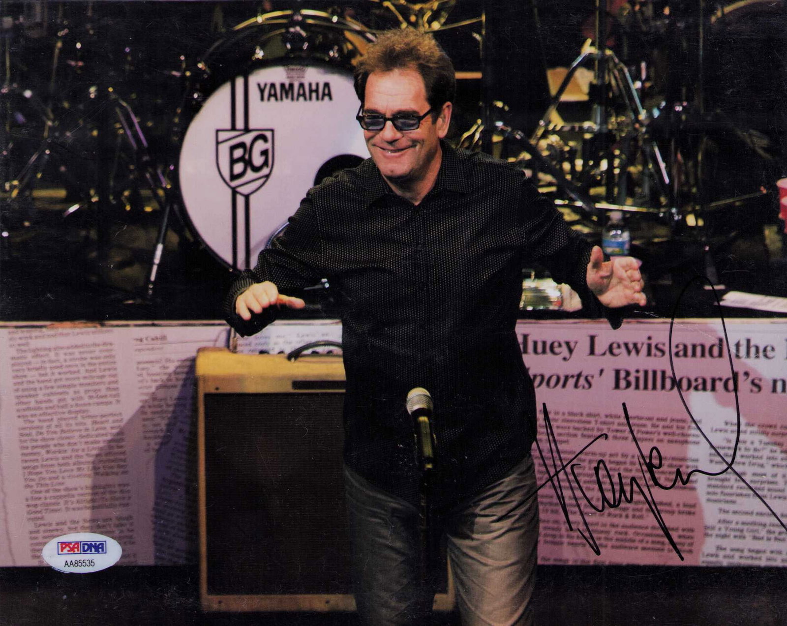 Huey Lewis signed photograph PSA: A nice signed 8x10 of the legendary rocker PSA DNA stickered Certificate of AuthenticityEVERY item in this auction comes with at minimum one fully illustrated and serial numbered COA signed by the