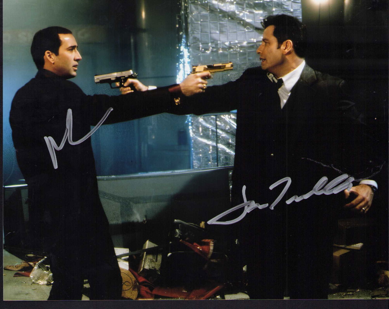 Face Off Travolta and Cage signed photograph: The classic scene signed by both legends John Travolta and Nicolas Cage Certificate of AuthenticityEVERY item in this auction comes with at minimum one fully illustrated and serial numbered COA signed