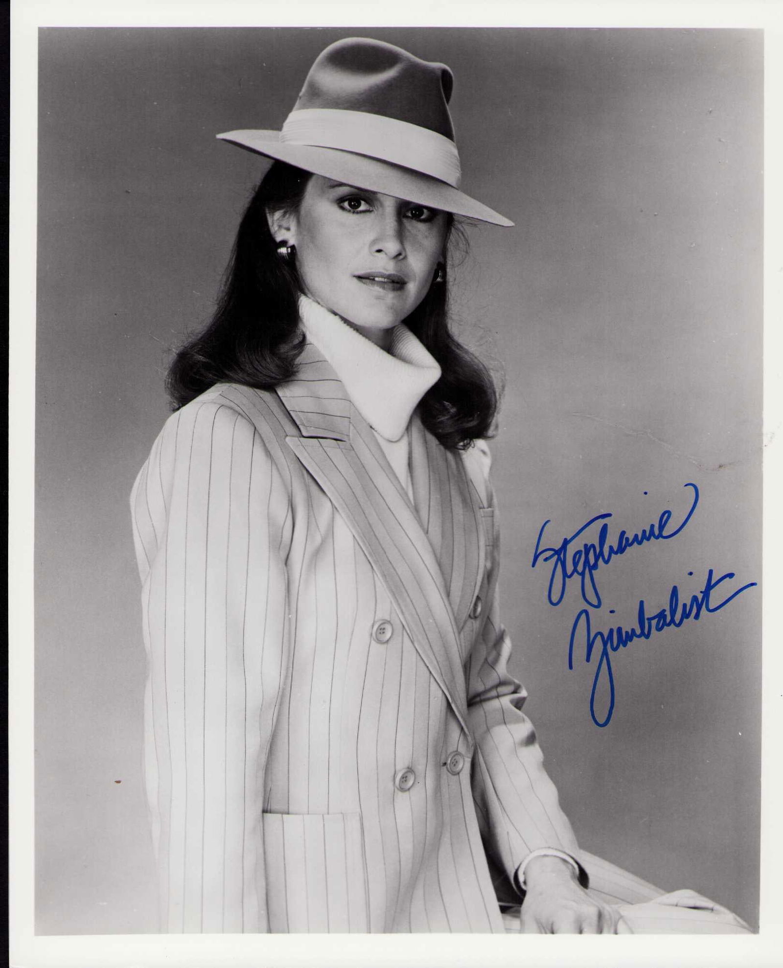 Stephanie Zimbalist signed photograph: From the show Remington Steele comes this vintage signed 8x10 costarred with Pierce Brosnan Certificate of AuthenticityEVERY item in this auction comes with at minimum one fully illustrated and serial