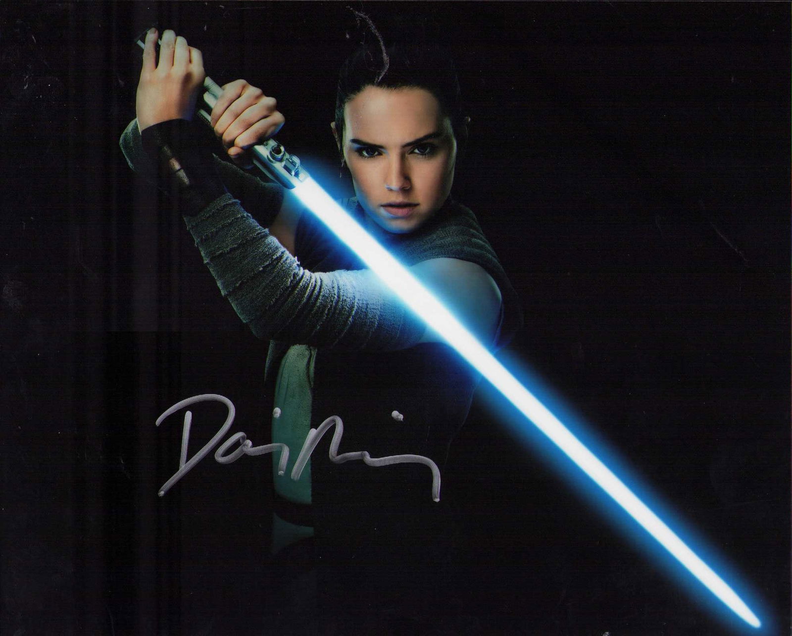 Daisy Ridley Signed Star Wars photograph: Signed from Star Wars films as Rey ate of AuthenticityEVERY item in this auction comes with at minimum one fully illustrated and serial numbered COA signed by the worlds leading authenticator in Enter
