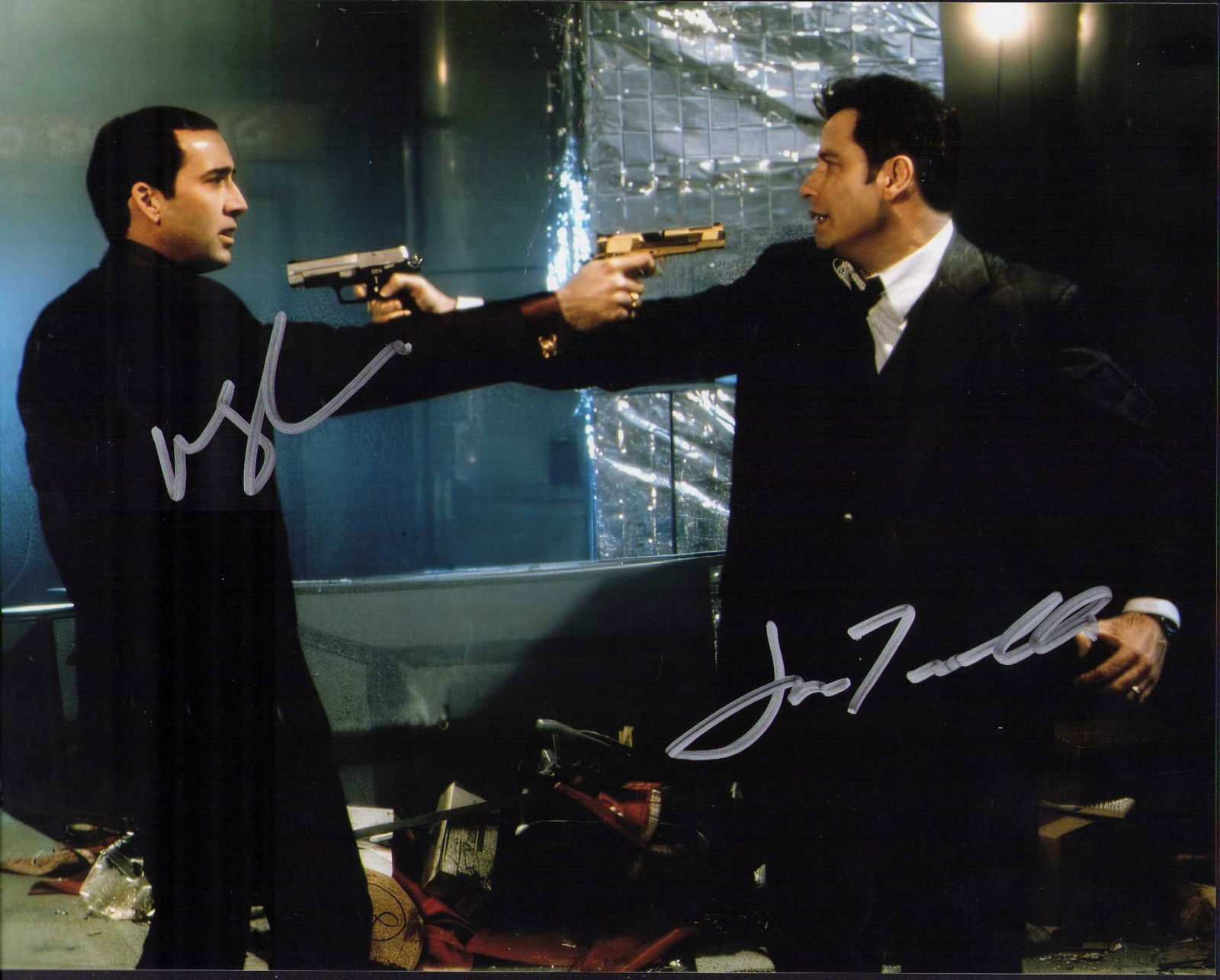 Face Off cast signed photograph: A wonderful Face Off cast signed 8x10 by John Travolta and Nicolas Cage both ate of AuthenticityEVERY item in this auction comes with at minimum one fully illustrated and serial numbered COA signed