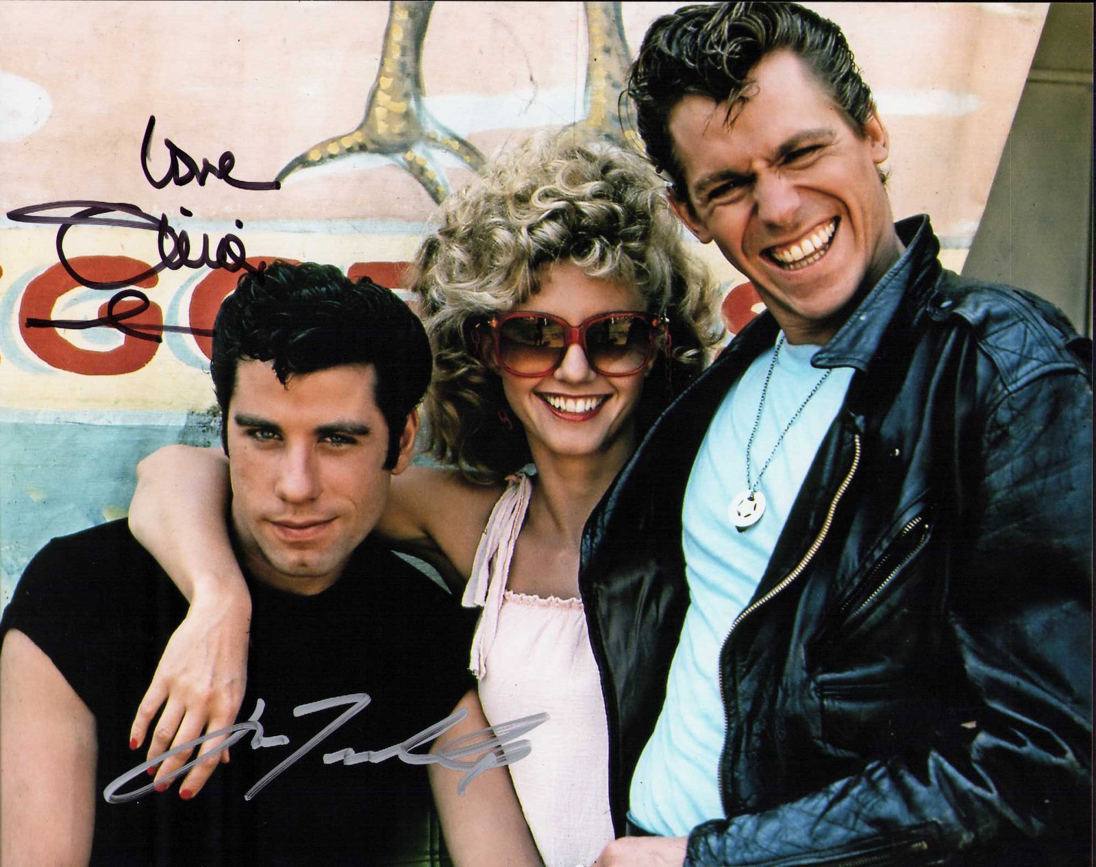 Olivia and John Grease signed photograph: A Grease signed cast shot by Olivia Newton John and John Travolta ate of AuthenticityEVERY item in this auction comes with at minimum one fully illustrated and serial numbered COA signed by the