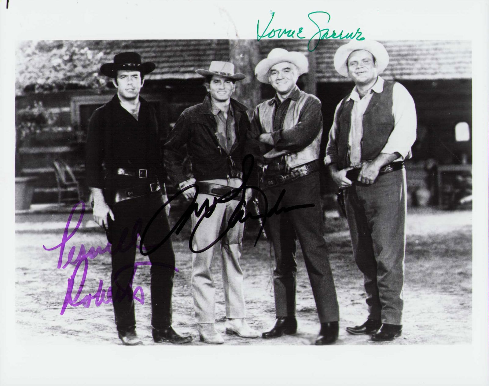 Bonanza cast signed photograph: A rare Bonanza cast signed 8x10 by Lorne Greene Michael Landon and Pernell Roberts on a vintage still at the famed Ponderosa ranch Certificate of AuthenticityEVERY item in this auction comes with at