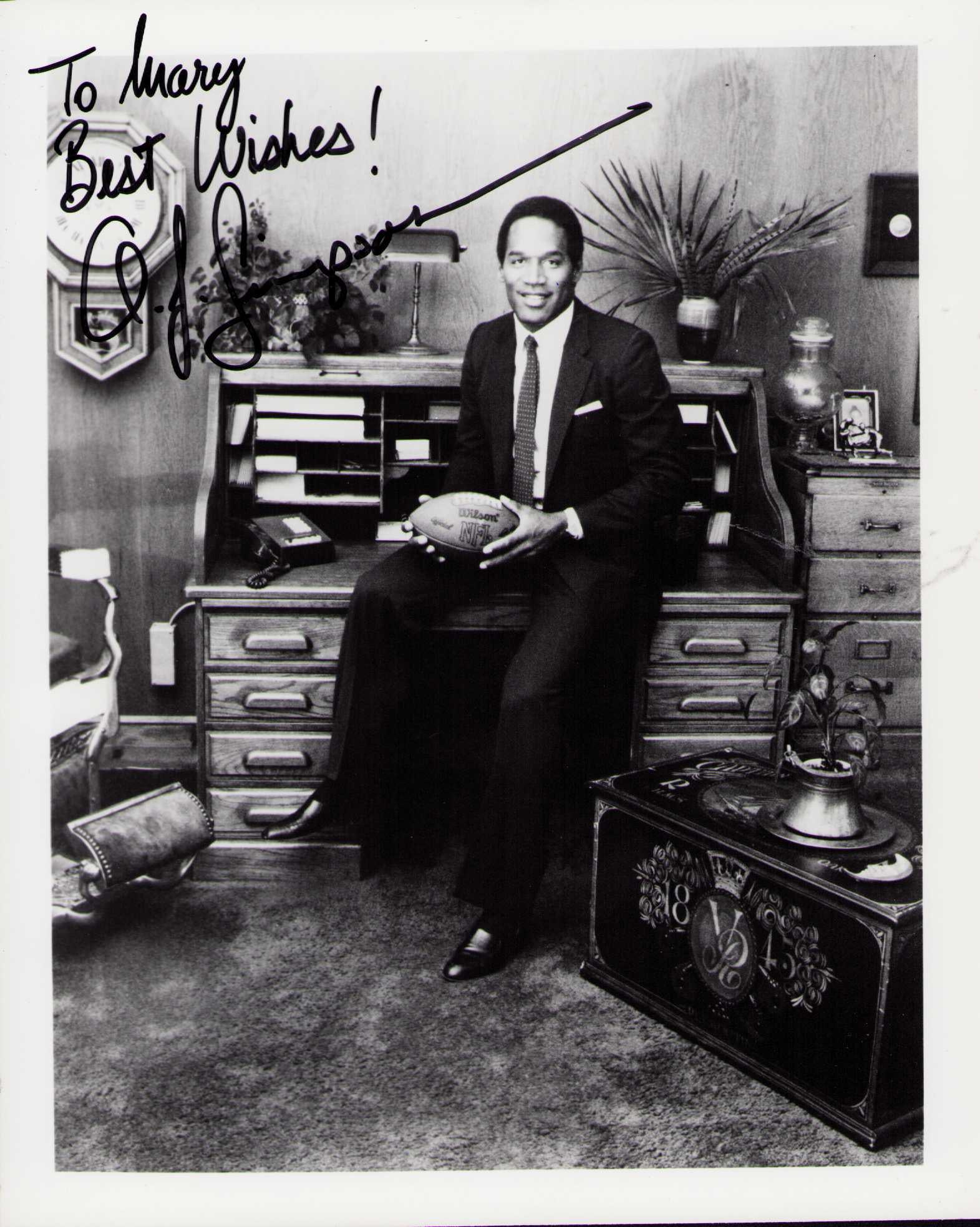 O.J. Simpson vintage signed photograph: A VINTAGE signed 8x10 of the football legend and possible murderer Certificate of AuthenticityEVERY item in this auction comes with at minimum one fully illustrated and serial numbered COA signed by t