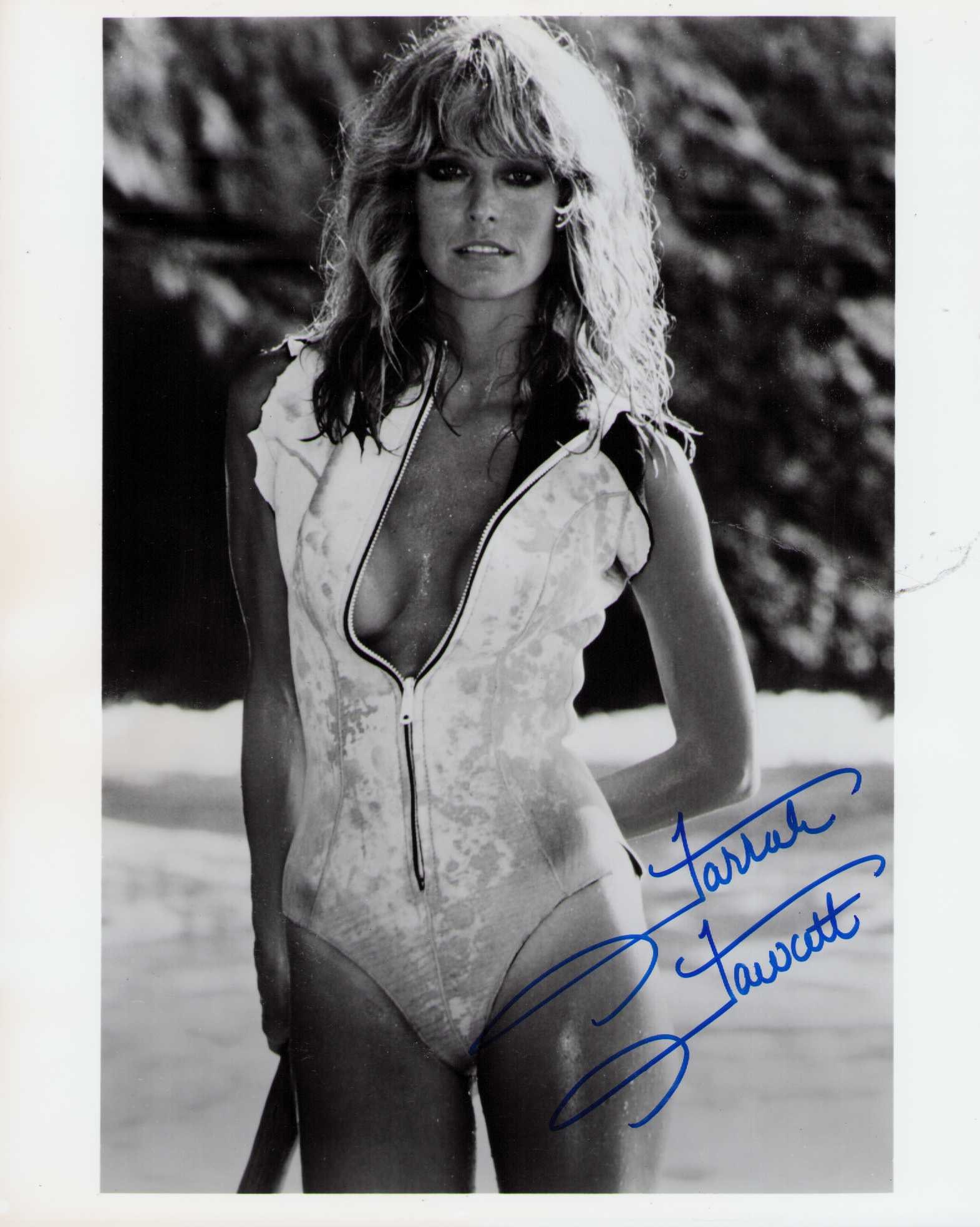 Farrah Fawcett signed photograph: A sexy vintage signed in FULL name by her rare 8x10 photograph this was also a poster image she released in the 70s that sold well Certificate of AuthenticityEVERY item in this auction comes with at m
