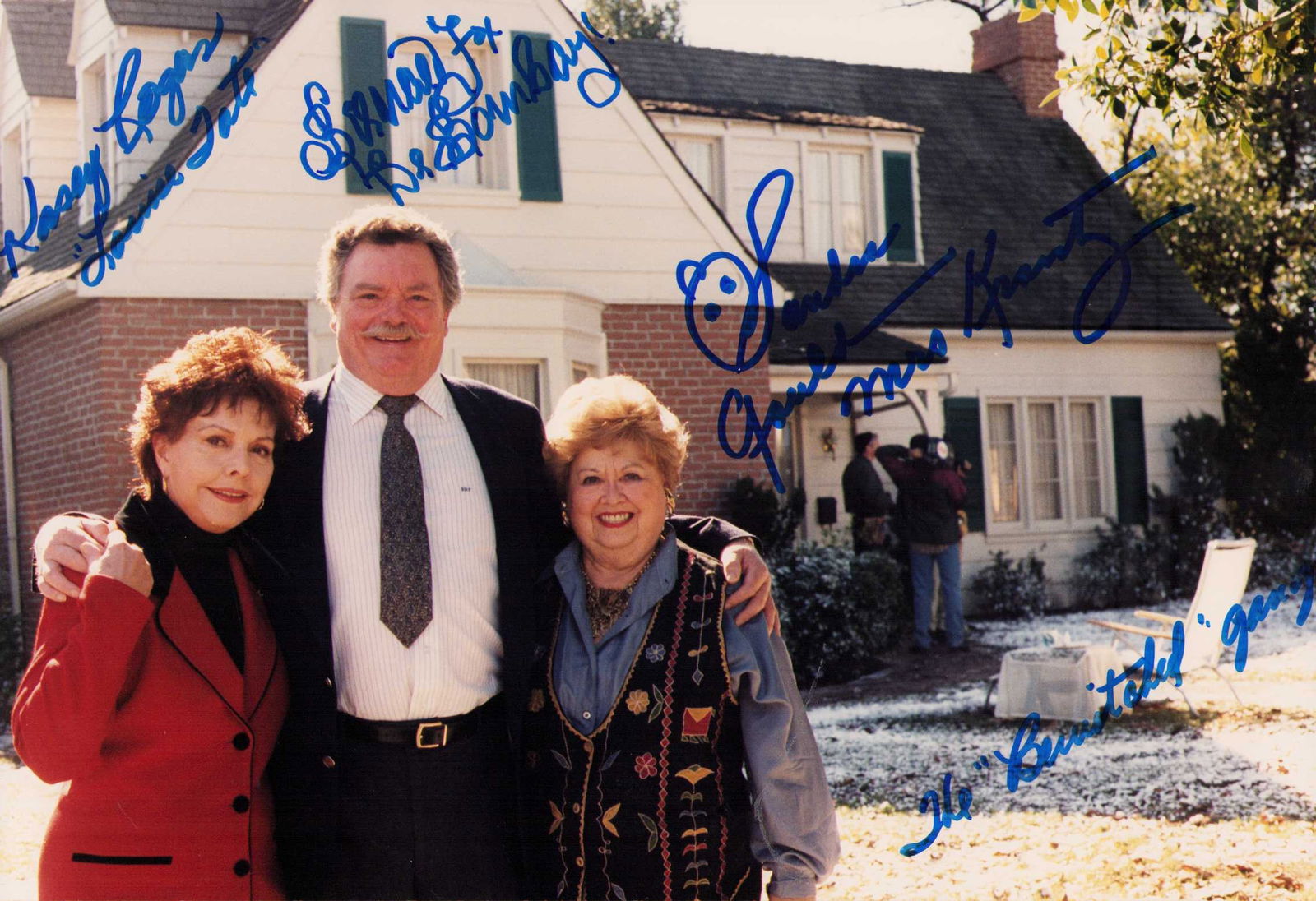 RARE Bewitched signed cast photograph: A RARE Bewitched cast which is a reunioon shot outside the original house used in the series by Bernard Fox as Dr Bombay Sandra Gould as Gladys Kravitz and Kasey Rogers as Mrs Tate all signed adding