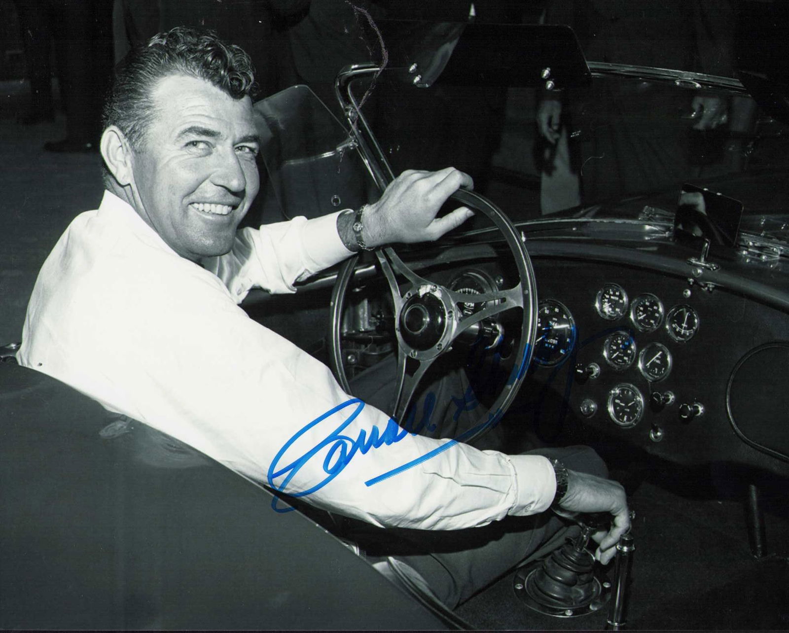 Carroll Shelby signed photograph: A rare signed younger years racing shot of the man who created the MUSTANG Certificate of AuthenticityEVERY item in this auction comes with at minimum one fully illustrated and serial numbered COA