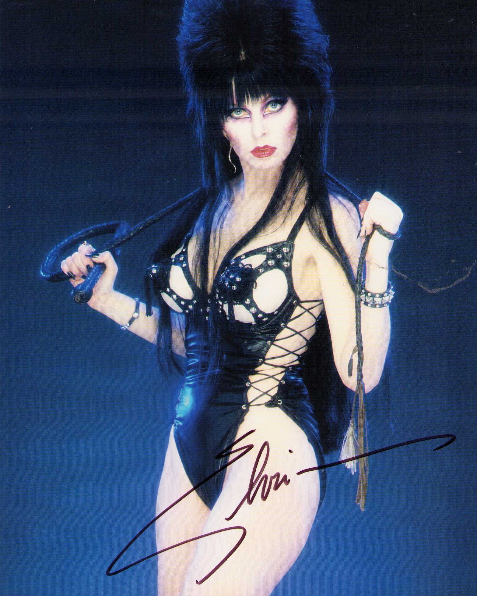 Elvira signed photograph: A sexy signed 8x10 of the Mistress of the Night herself now retired and no longer signing Certificate of AuthenticityEVERY item in this auction comes with at minimum one fully illustrated and serial n