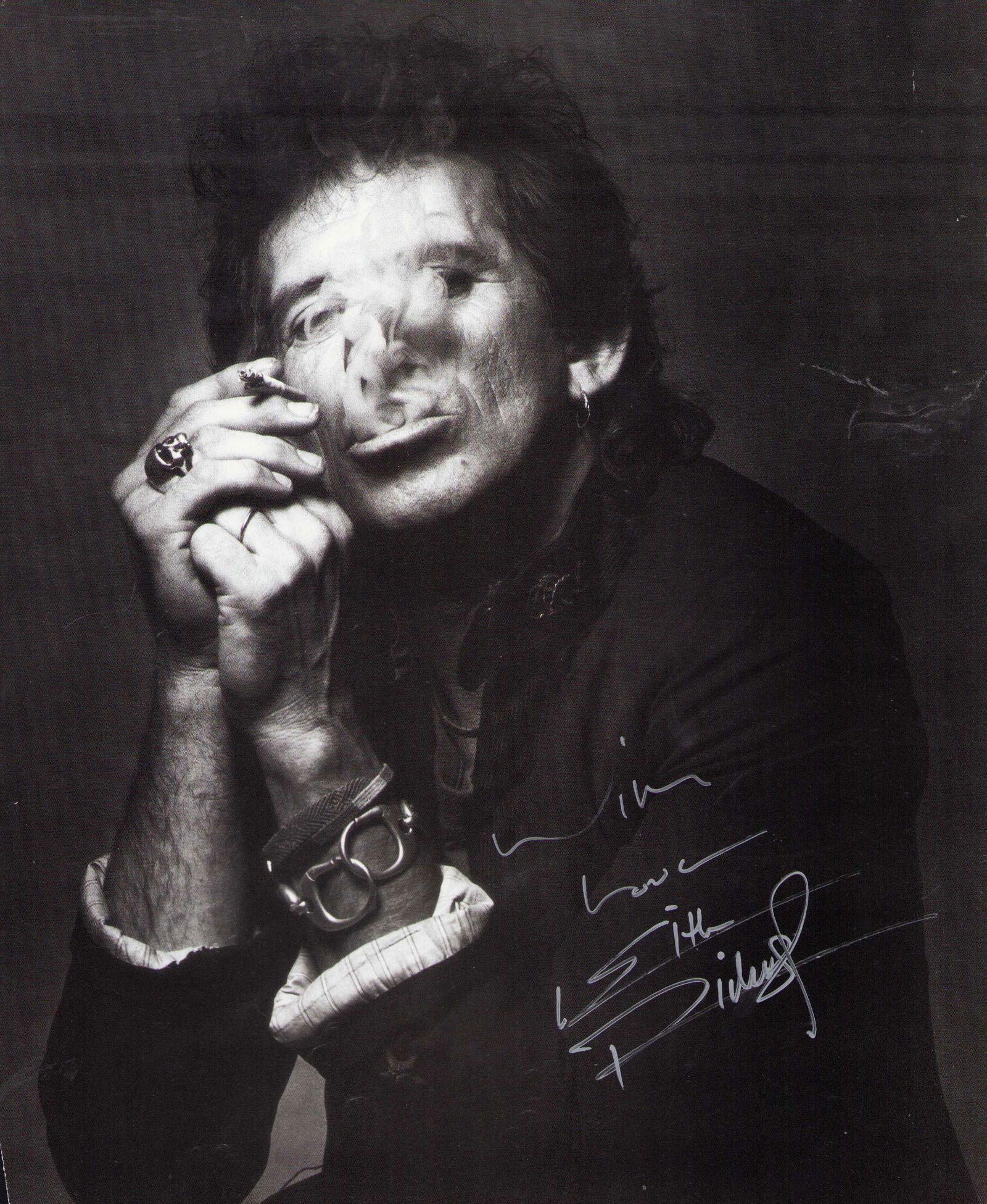 Keith Richards signed 11x14 photograph: An 11x14 taken from a Rolling Stones coffee table book signed by the Stones legendary guitarist Certificate of AuthenticityEVERY item in this auction comes with at minimum one fully illustrated and