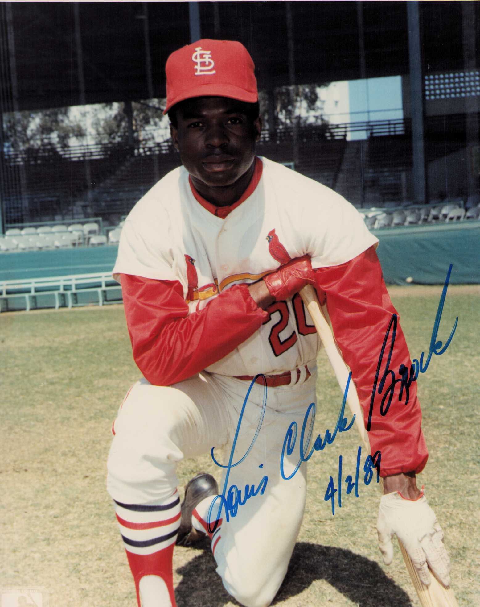 Lou Brock signed photograph: A RARE Lou Brock signed with his FULL real name ever seen one ? Louis Clarke Brock Certificate of AuthenticityEVERY item in this auction comes with at minimum one fully illustrated and serial