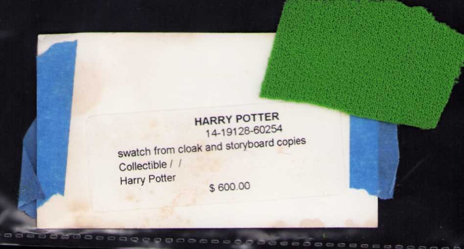 Harry Potter fragment of Invisibility cloak: A piece of the green screen fabric used for the Cloak of Invisibility scenes in Harry Potter originally acquired by Star Wares Certificate of AuthenticityEVERY item in this auction comes with at