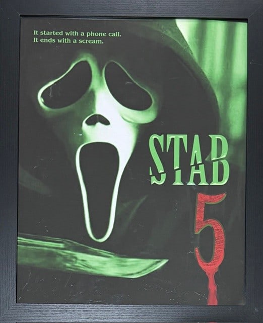 Scream 7 framed art seen on screen in macher house: A framed STAB poster seen on screen and used in the film Scream 7 acquired from an auction of set pieces for cast and crew at the films finish Certificate of AuthenticityEVERY item in this auction