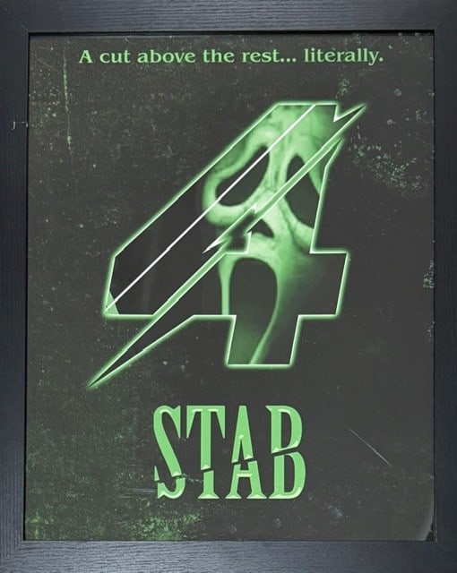 Scream 7 framed art seen on screen in macher house: A framed STAB poster seen on screen and used in the film Scream 7 acquired from an auction of set pieces for cast and crew at the films finish Certificate of AuthenticityEVERY item in this auction