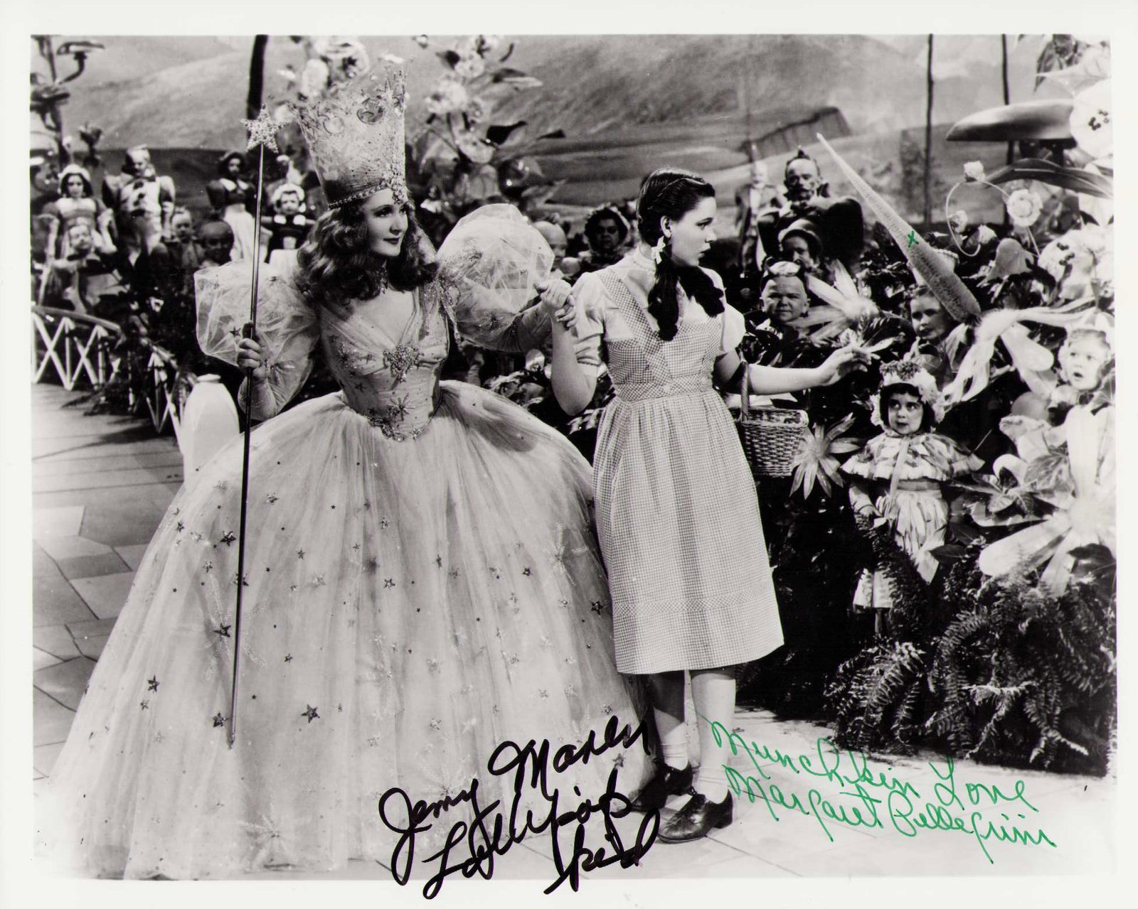 Wizard of Oz Munchkins signed photograph: A vintage OZ signed 8x10 by deceased munhkin stars Margaret Pellegrini and Jerry Maren Certificate of AuthenticityEVERY item in this auction comes with at minimum one fully illustrated and serial