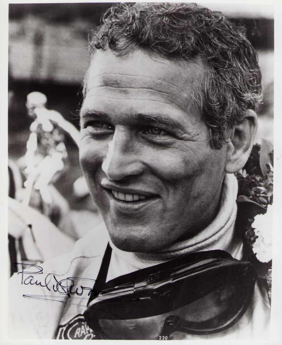 Paul Newman signed photograph: A vintage signed 8x10 of the legendary actor USUALLY a secretary signed item is seen or even stickered by the non expert sticker companies this is a real one ! From Le Mans film he raced in real life