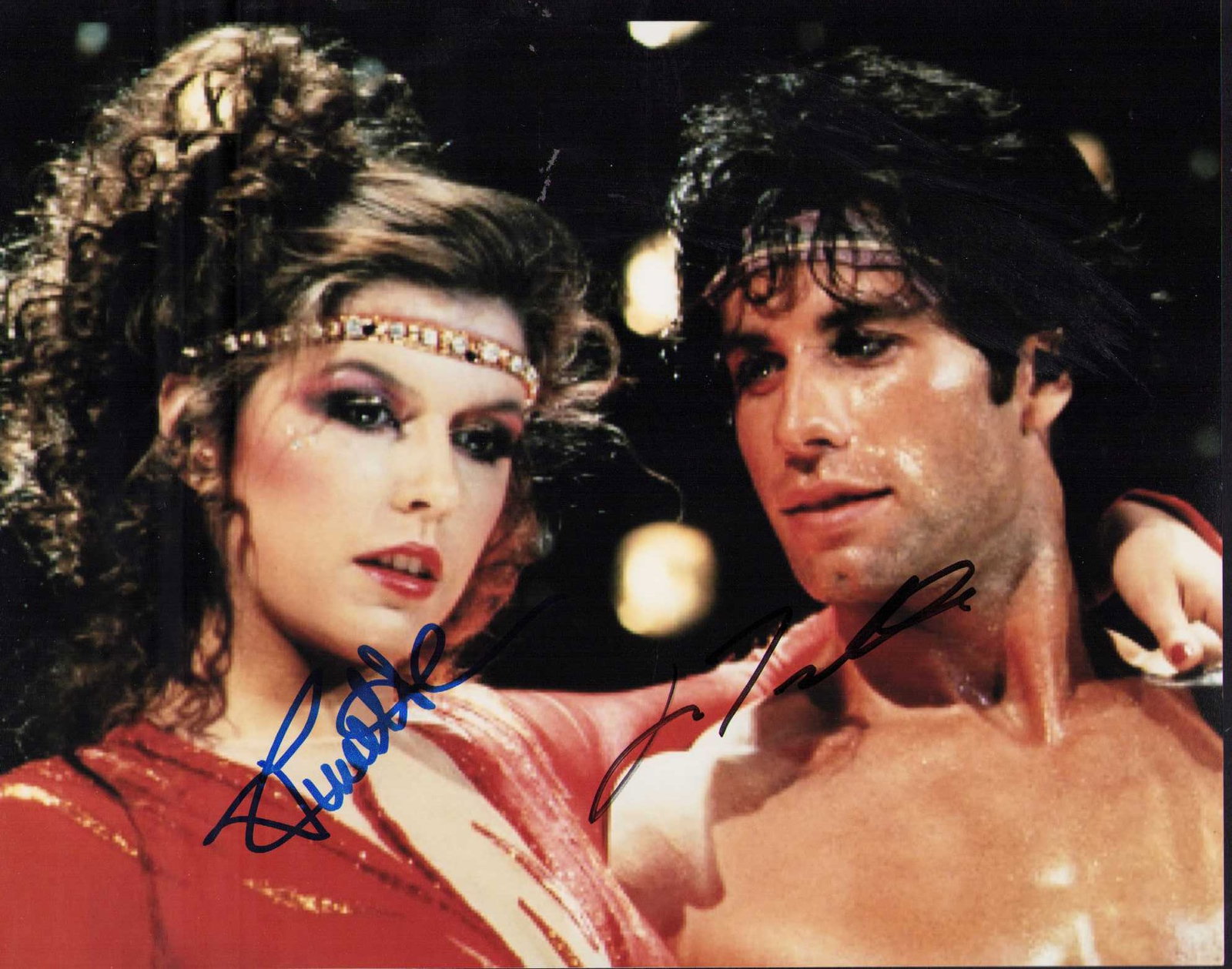 Staying Alive cast signed photograph: Finola Hughes and John Travolta signed photograph from the Sat Nite Fever sequel Certificate of AuthenticityEVERY item in this auction comes with at minimum one fully illustrated and serial numbered C