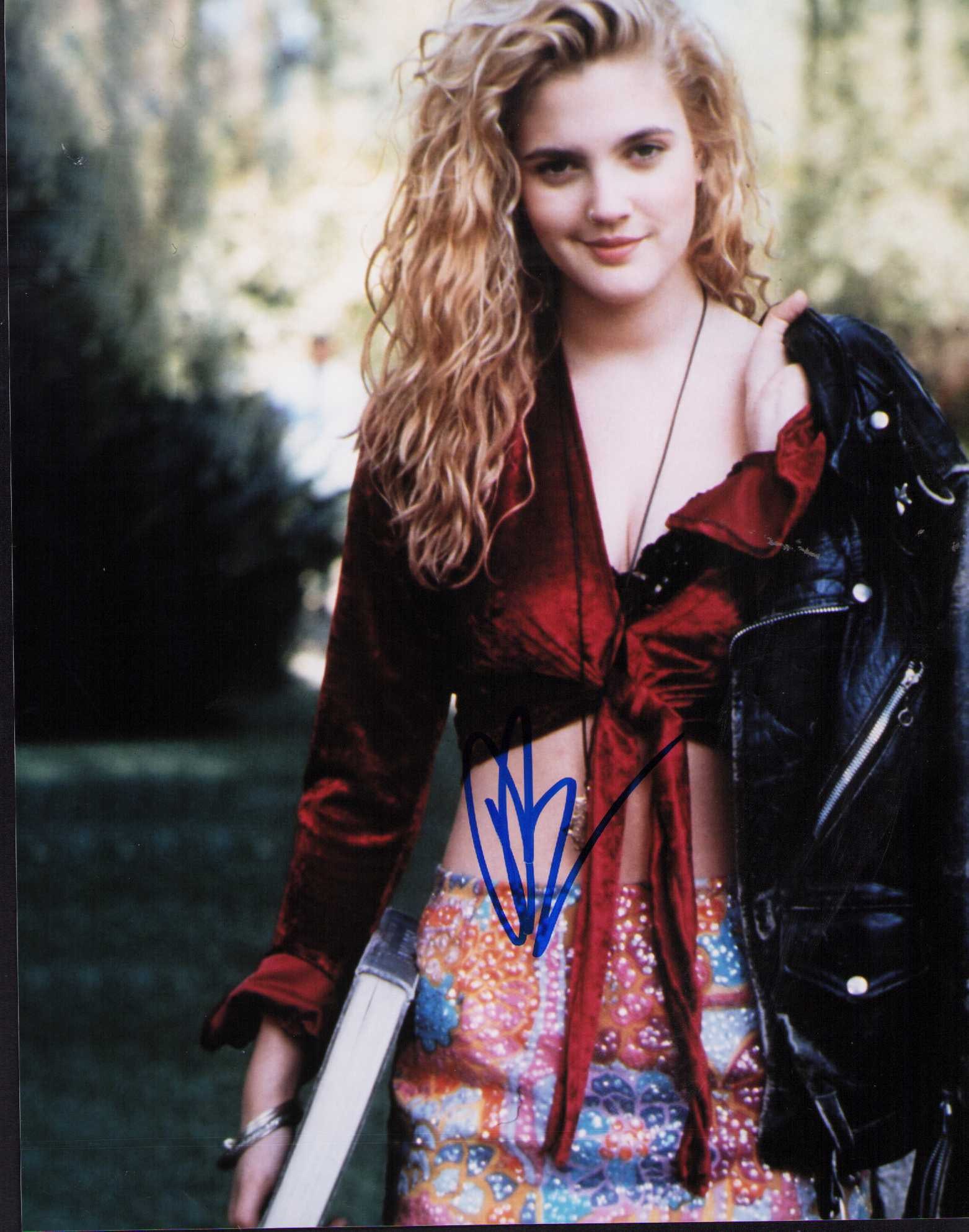 Drew Barrymore signed photograph: A sexy young vintage signed 8x10 of the actress Certificate of AuthenticityEVERY item in this auction comes with at minimum one fully illustrated and serial numbered COA signed by the worlds leading a