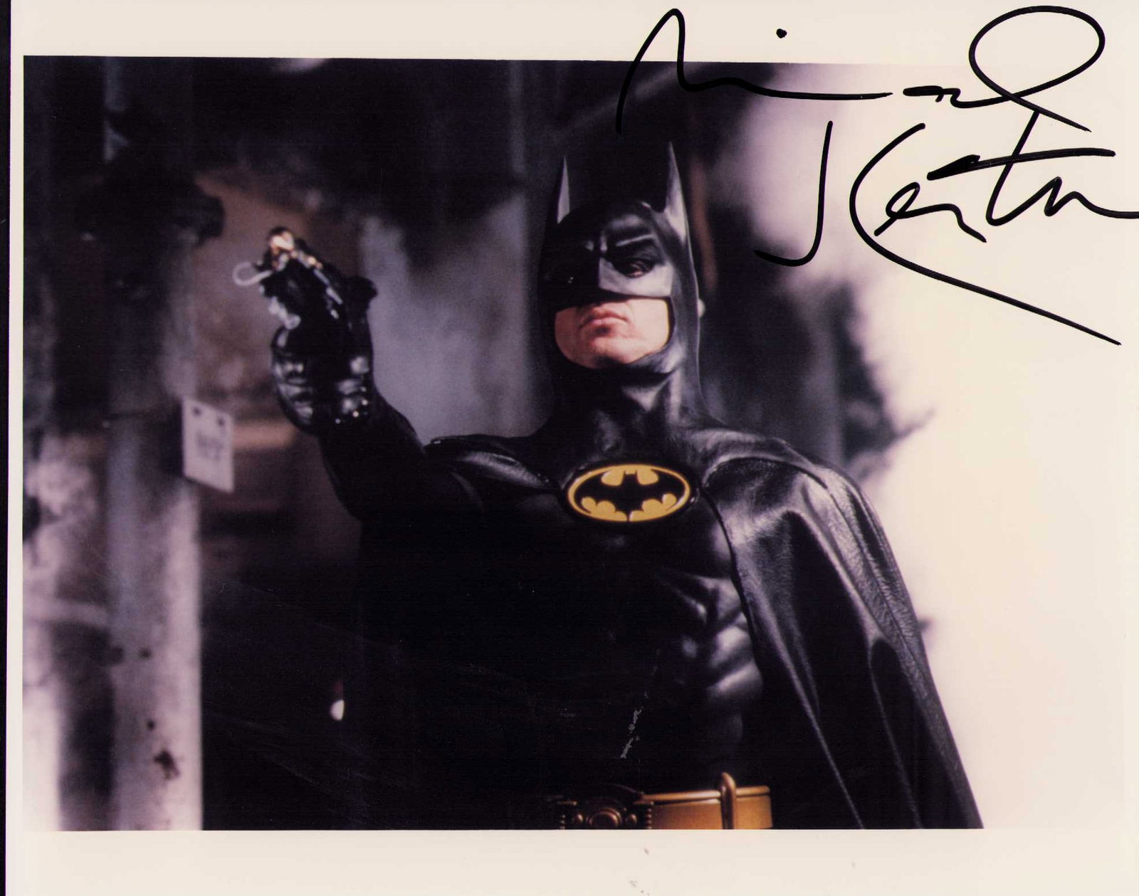 Michael Keaton signed vintage Batman photograph: A VINTAGE signed in the 80s Batman color 8x10 photograph of Keaton Certificate of AuthenticityEVERY item in this auction comes with at minimum one fully illustrated and serial numbered COA signed by t