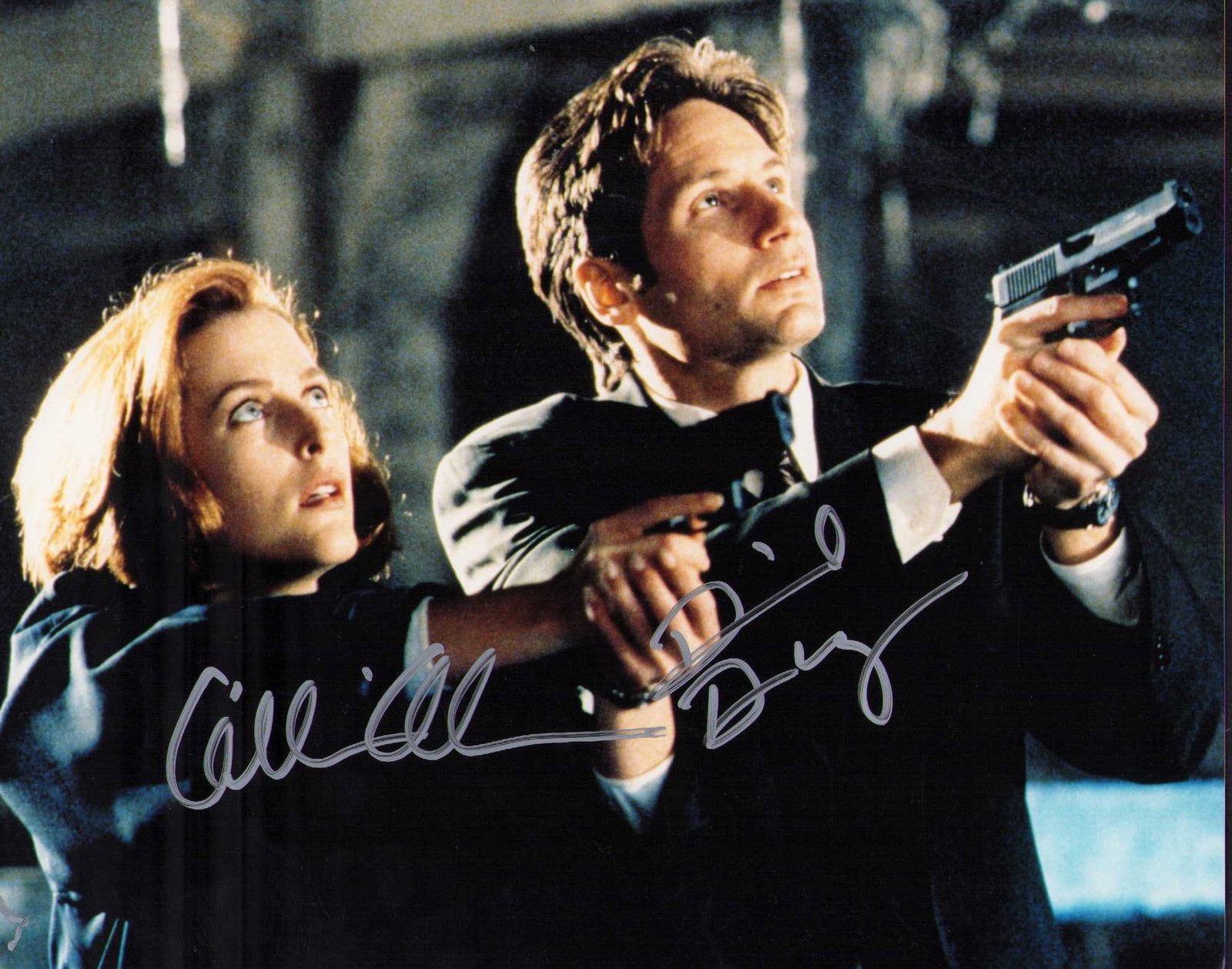 X-Files cast signed photograph: A vintage signed X-Files 8x10 cast signed photograph by Gillian Anderson and David Duchovney both ! Certificate of AuthenticityEVERY item in this auction comes with at minimum one fully illustrated an