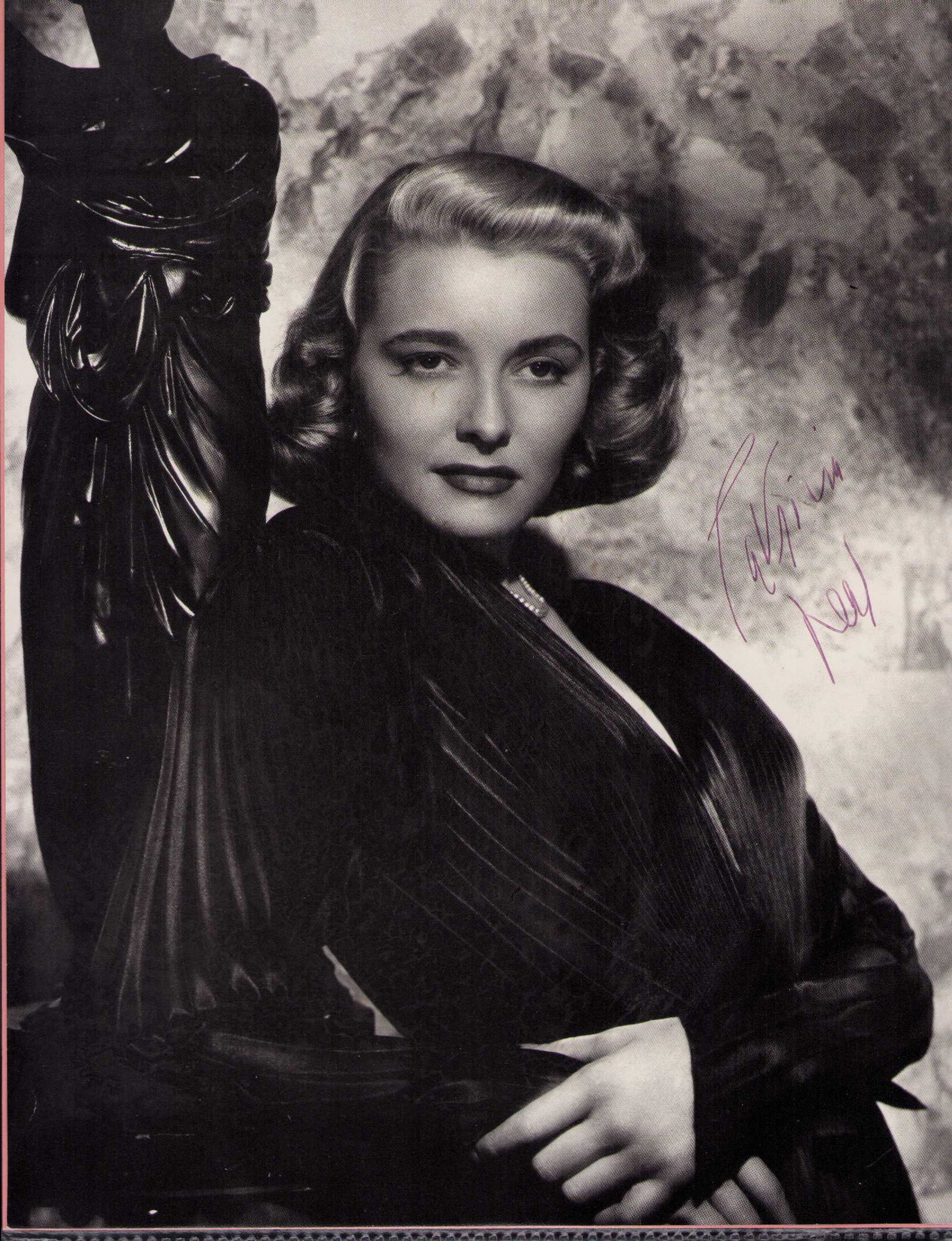 Patricia Neal signed photograph: A larger signed photograph 9x12 taken from a coffee table book signed by the legend Certificate of AuthenticityEVERY item in this auction comes with at minimum one fully illustrated and serial numbere