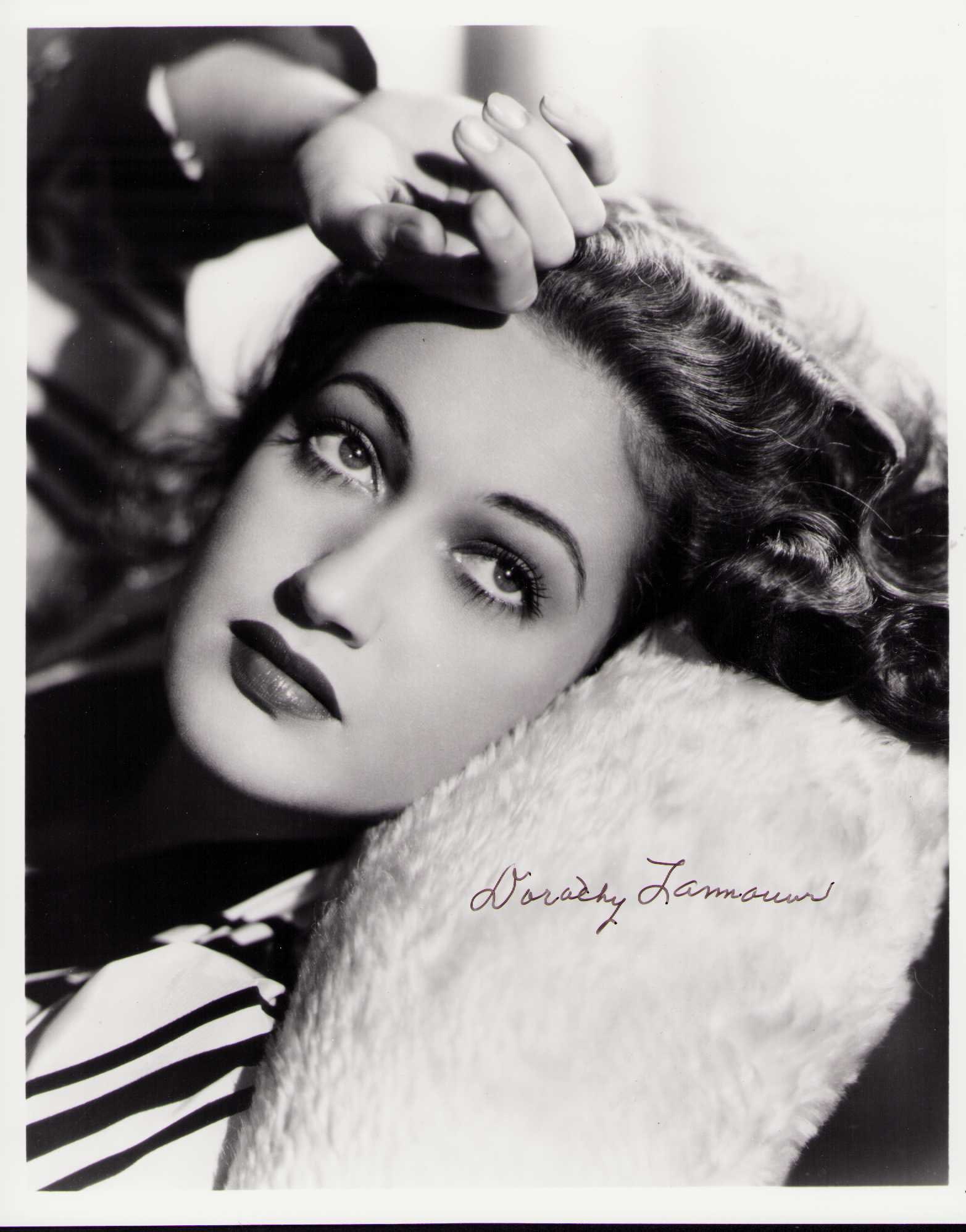 Dorothy Lamour signed photograph: A vintage signed 8x10 of the legendary actress of the Road pictures among others Certificate of AuthenticityEVERY item in this auction comes with at minimum one fully illustrated and serial numbered C