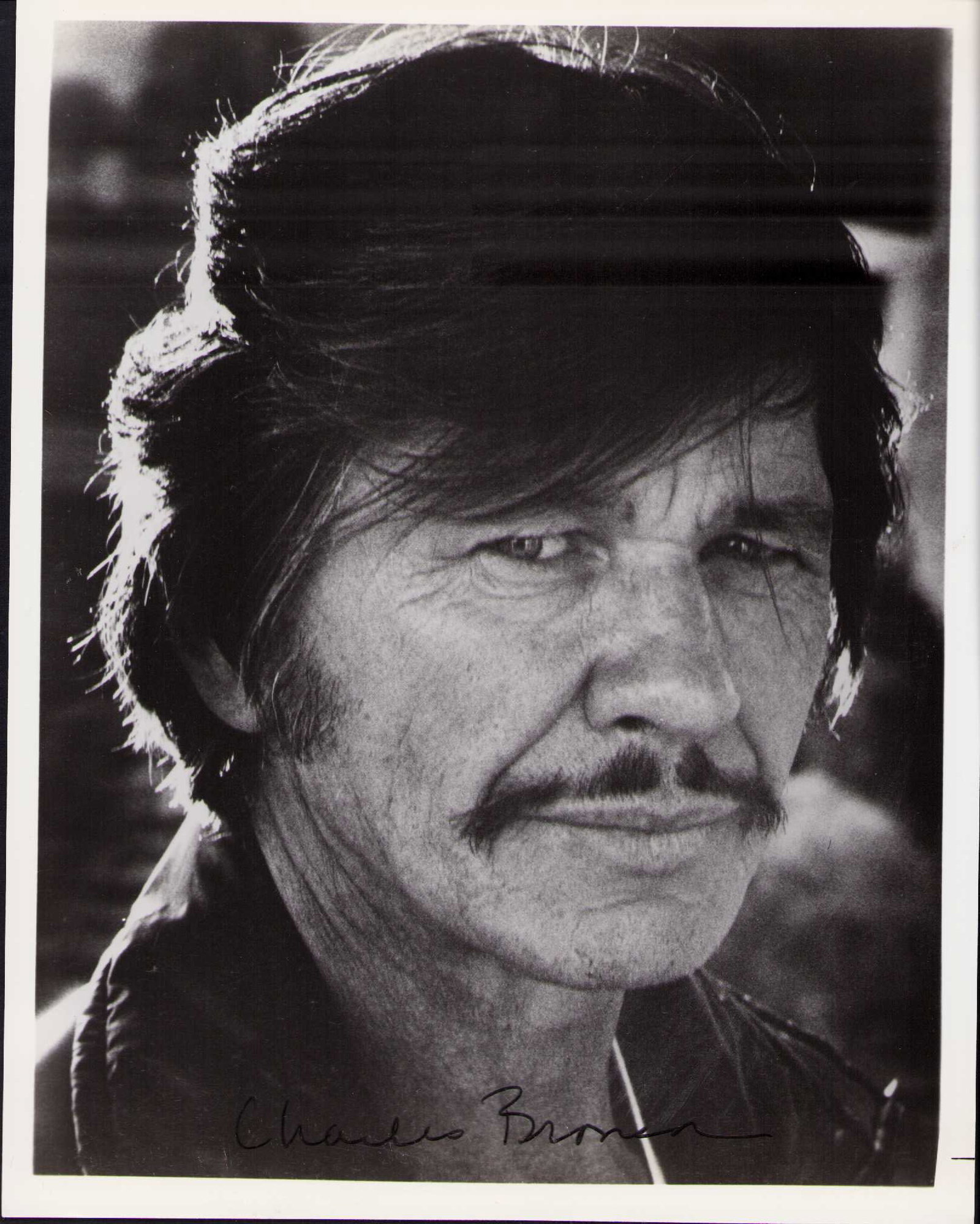 Charles Bronson signed photograph: A rare vintage signed 8x10 of the cinemas first action star Certificate of AuthenticityEVERY item in this auction comes with at minimum one fully illustrated and serial numbered COA signed by the worl