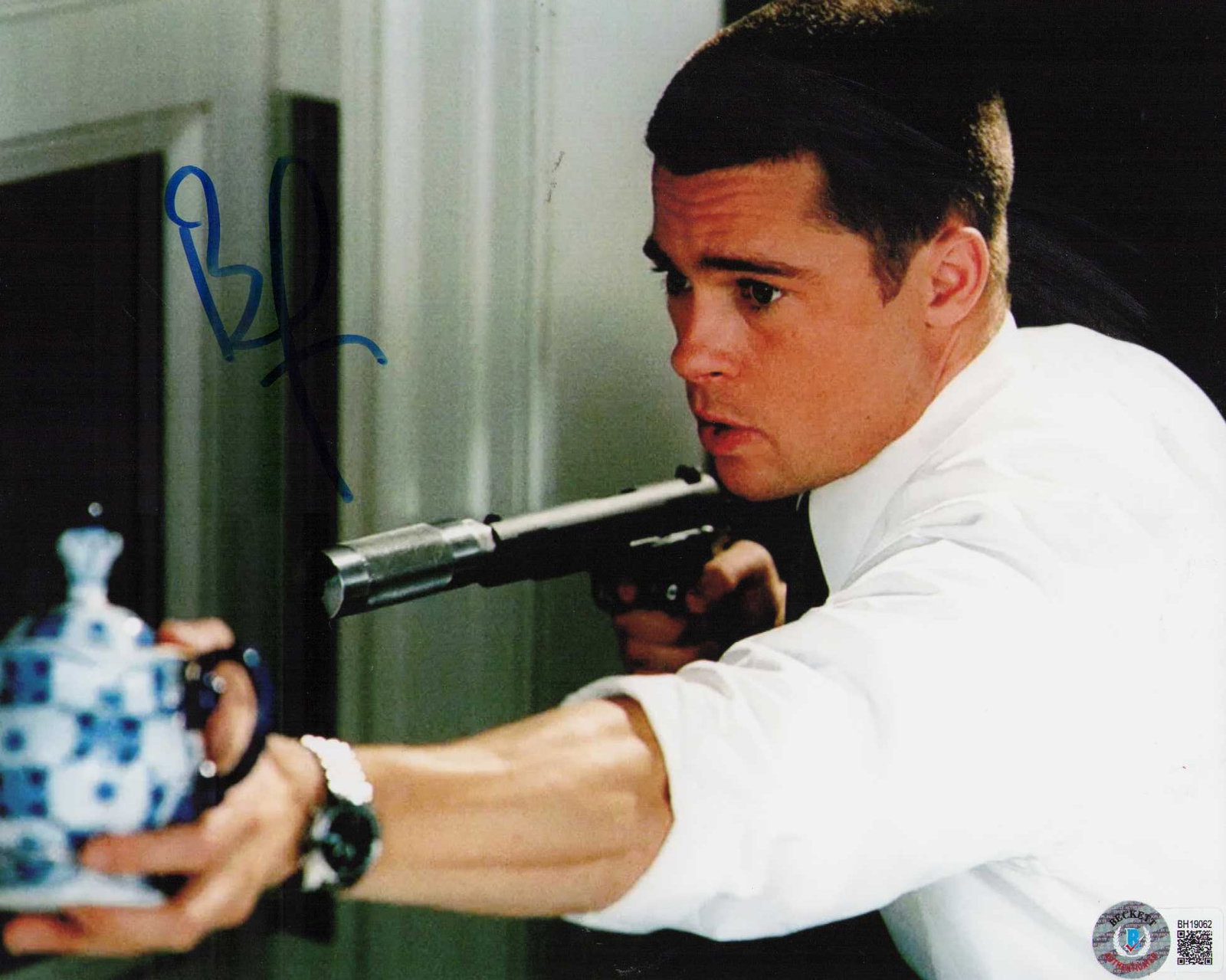 Brad Pitt Beckett signed photograph: A sexy signed vintage 8x10 of legend Brad Pitt with Beckett sticker Certificate of AuthenticityEVERY item in this auction comes with at minimum one fully illustrated and serial numbered COA signed by