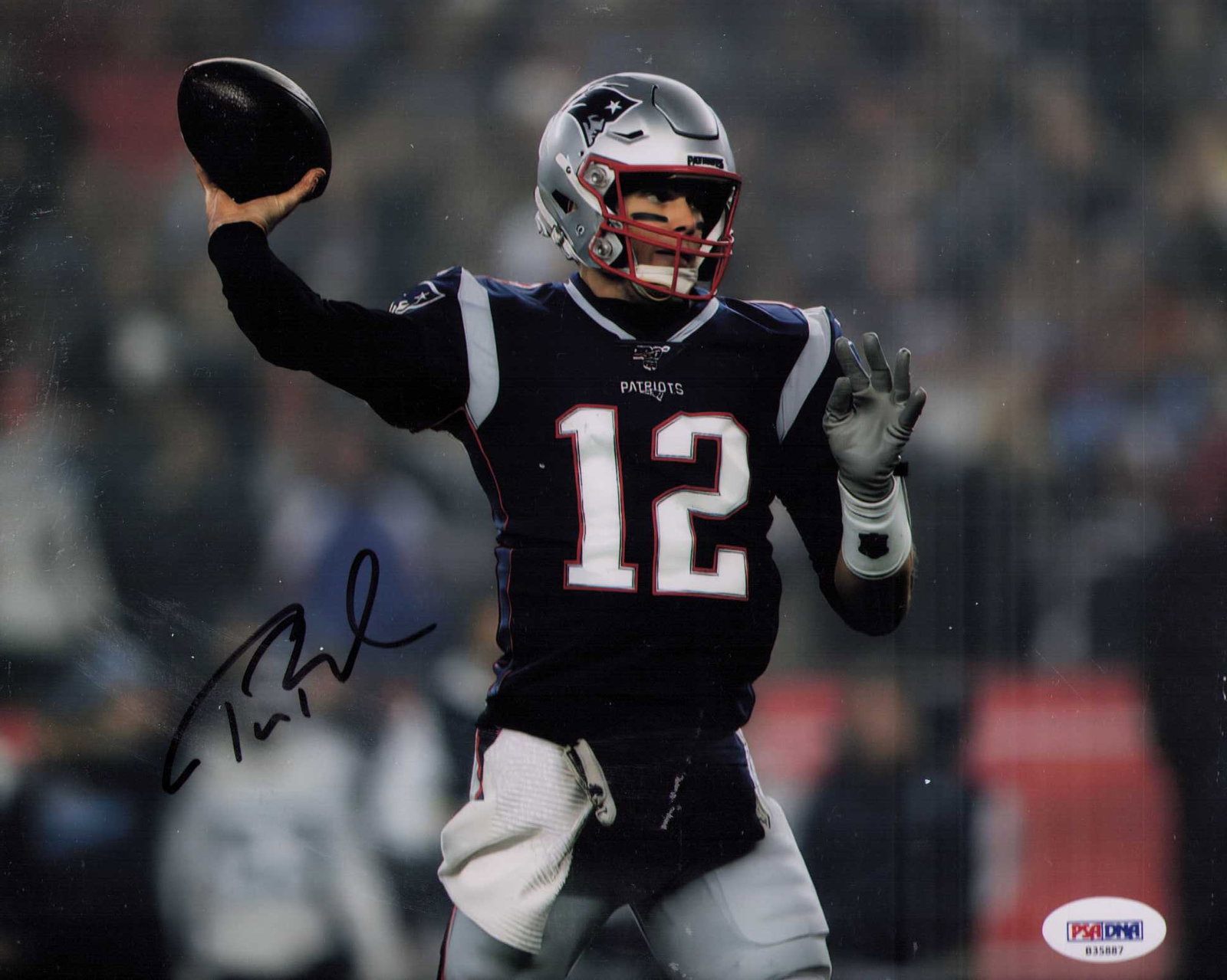 Tom Brady signed photograph PSA DNA: A fantastic signed Patriots shot of the GOAT himself with PSA DNA sticker and card as well Certificate of AuthenticityEVERY item in this auction comes with at minimum one fully illustrated and serial