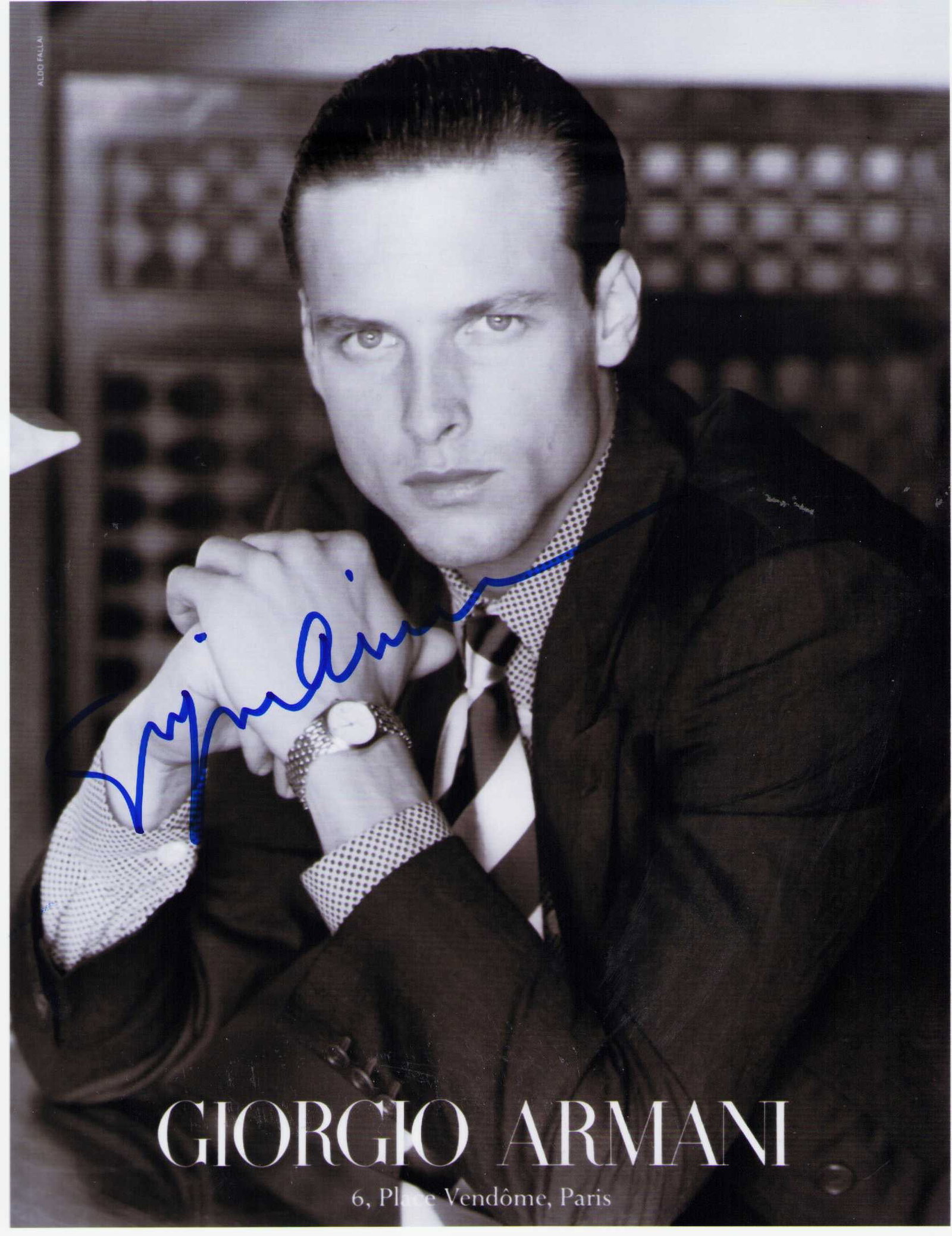 Giorgio Armani signed photograph: A rare advertising 8x10 signed by the deceased fashion legend Georgio Armani Certificate of AuthenticityEVERY item in this auction comes with at minimum one fully illustrated and serial numbered COA s