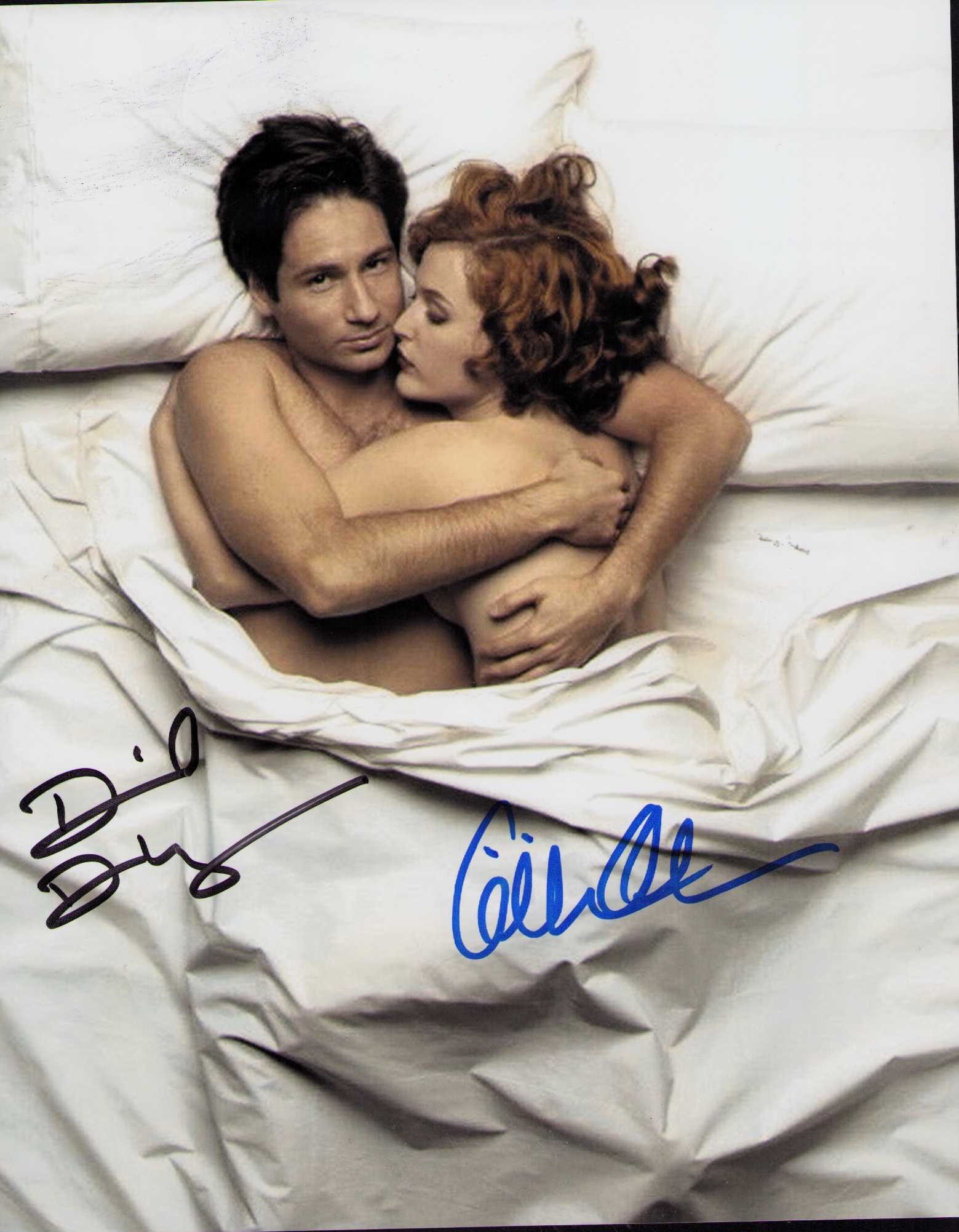 X-Files cast signed photograph: A vintage signed 8x10 by both stars Gillian Anderson and David Duchovney Certificate of AuthenticityEVERY item in this auction comes with at minimum one fully illustrated and serial numbered COA signe