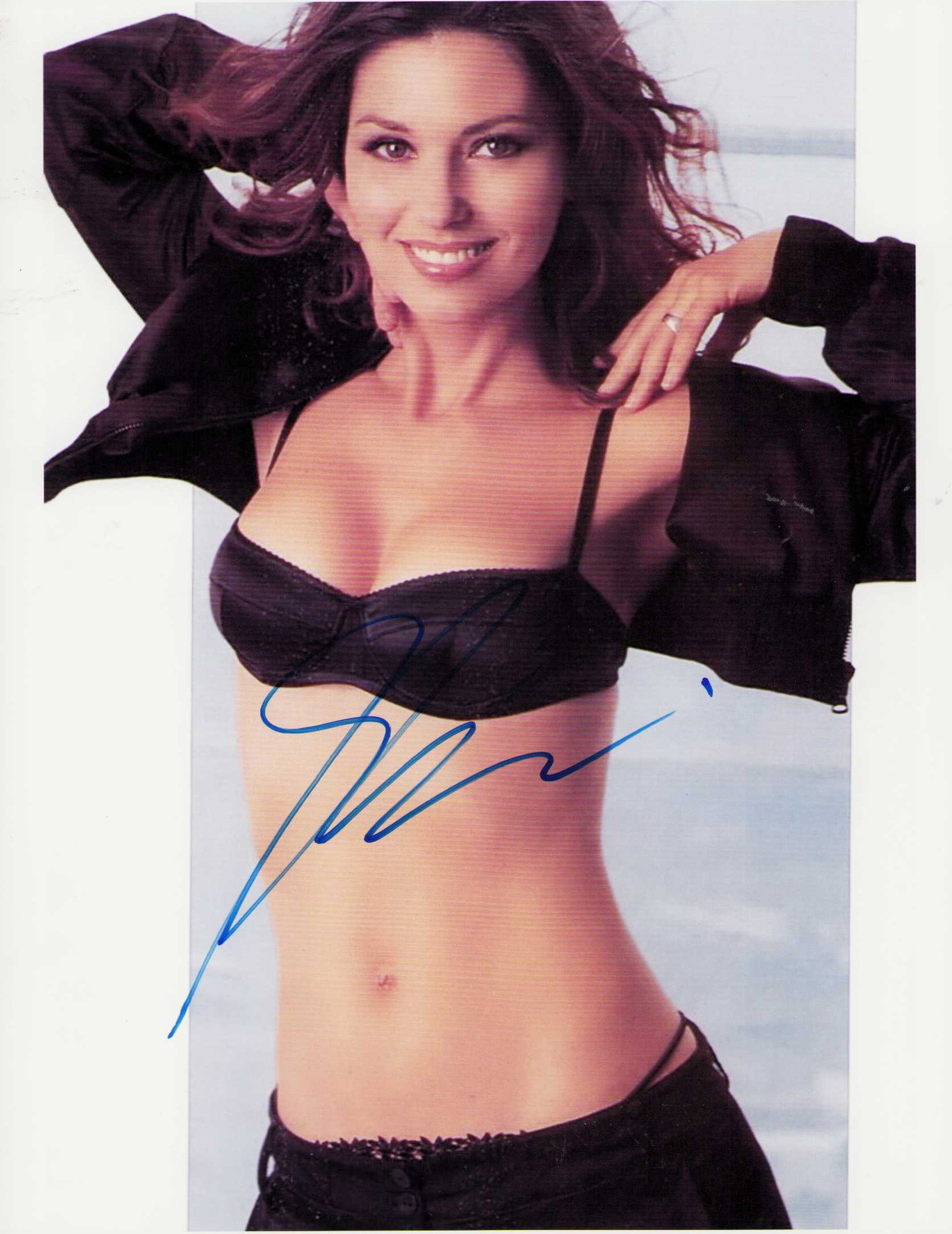 Shania Twain signed photograph: A sexy signed 8x10 by the pop and country music legend Certificate of AuthenticityEVERY item in this auction comes with at minimum one fully illustrated and serial numbered COA signed by the worlds le