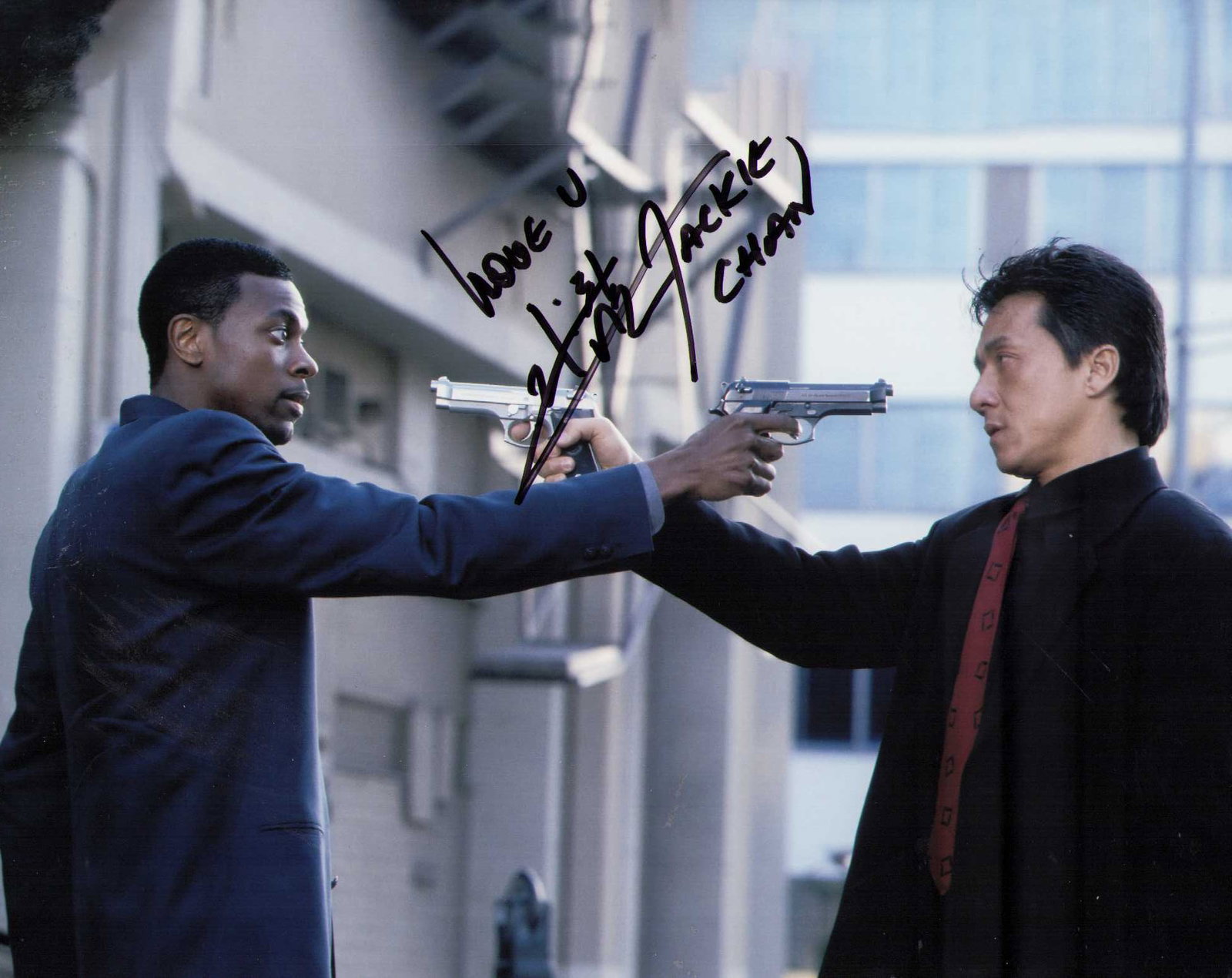 Jackie Chan signed photograph: Rush Hour scene still signed by the rare Chan in Chinese and English Certificate of AuthenticityEVERY item in this auction comes with at minimum one fully illustrated and serial numbered COA signed by