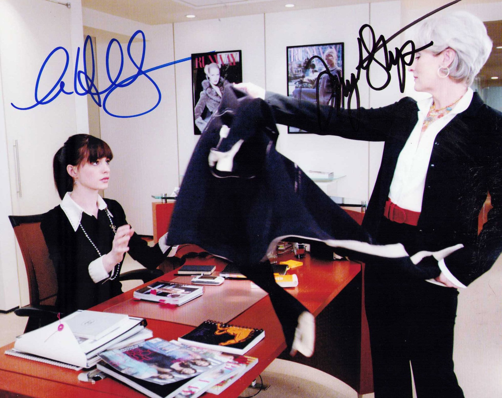 Devil Wears Prada cast signed photograph: A cast scene from first film signed by stars Meryl Streep and Anne Hathaway both scarce Certificate of AuthenticityEVERY item in this auction comes with at minimum one fully illustrated and serial num