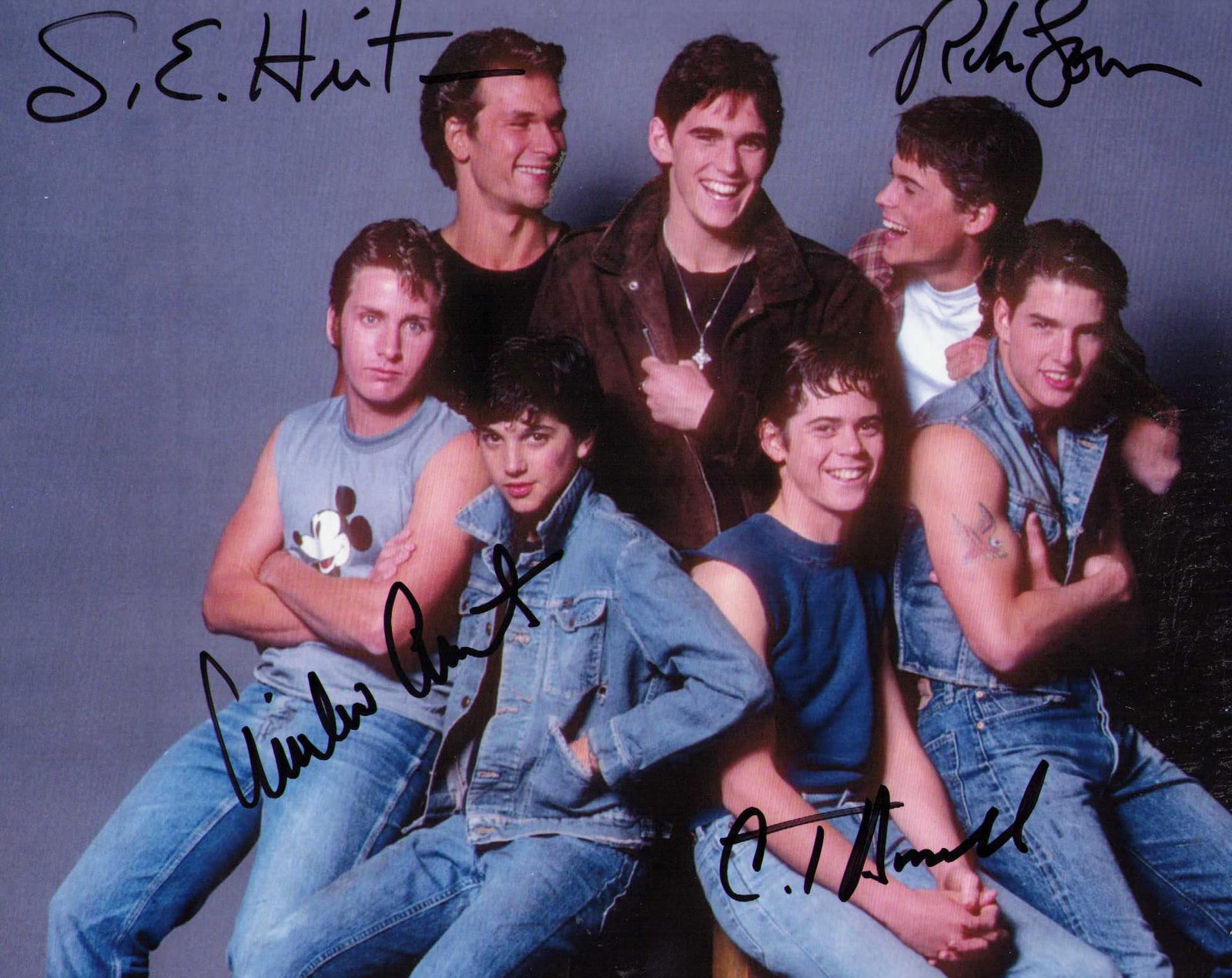 Outsiders cast signed photograph: A cast signed 8x10 by C Thomas Howell, Rob Lowe, Emeilio Estevez AND the rare author of the book SE Hinton ! Certificate of AuthenticityEVERY item in this auction comes with at minimum one fully illus