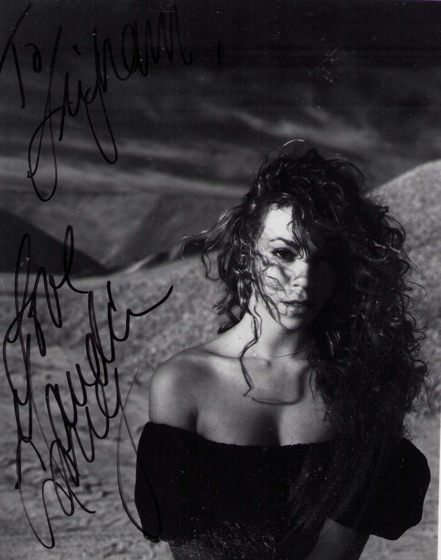 Mariah Carey VINTAGE signed photograph: A VINTAGE EARLY in her career signed 8x10 of the pop diva Certificate of AuthenticityEVERY item in this auction comes with at minimum one fully illustrated and serial numbered COA signed by the