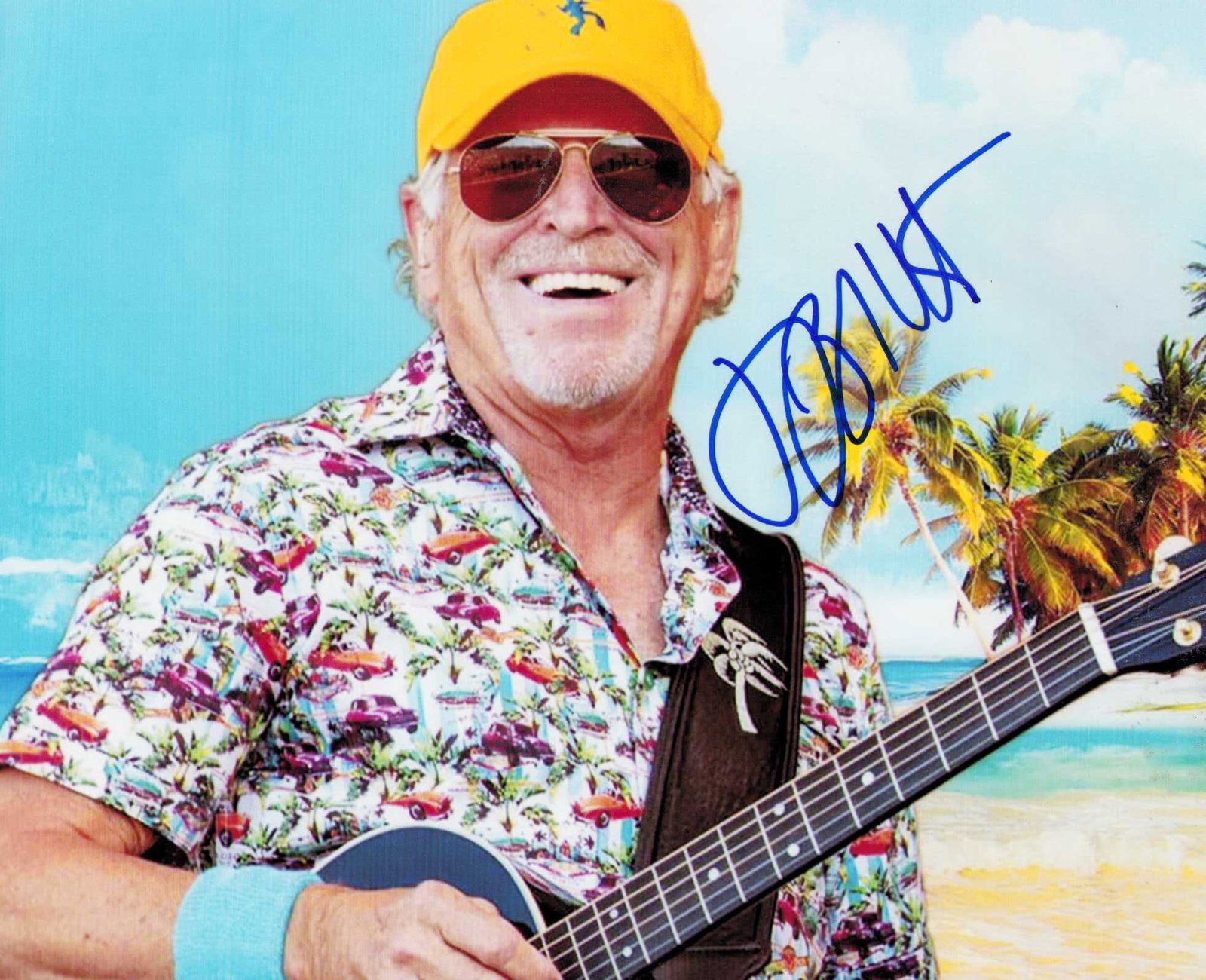 Jimmy Buffett signed photograph: A scarce signed 8x10 by the deceasd musical legend and head parrothead ! Certificate of AuthenticityEVERY item in this auction comes with at minimum one fully illustrated and serial numbered COA signe