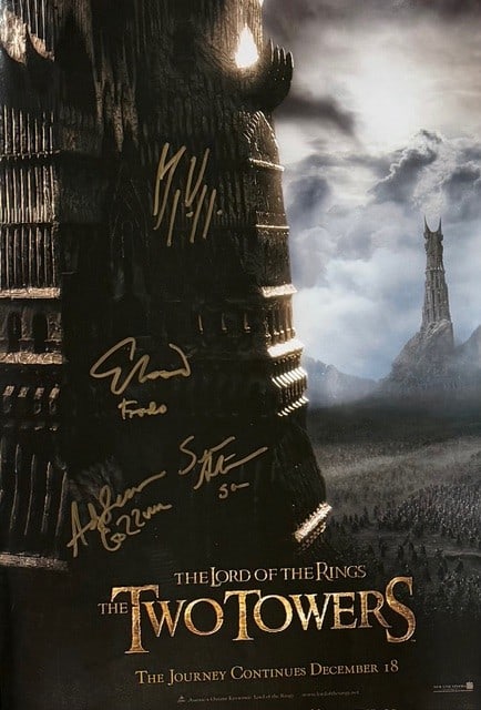 Two Towers Lord of the Rings 11x17 original cast signed premiere poster: An original premiere poster 11x17 signed by Sean Astin Andy Serkis Elijah Wood and Viggo Mortensen some adding characters names Certificate of AuthenticityEVERY item in this auction comes with at