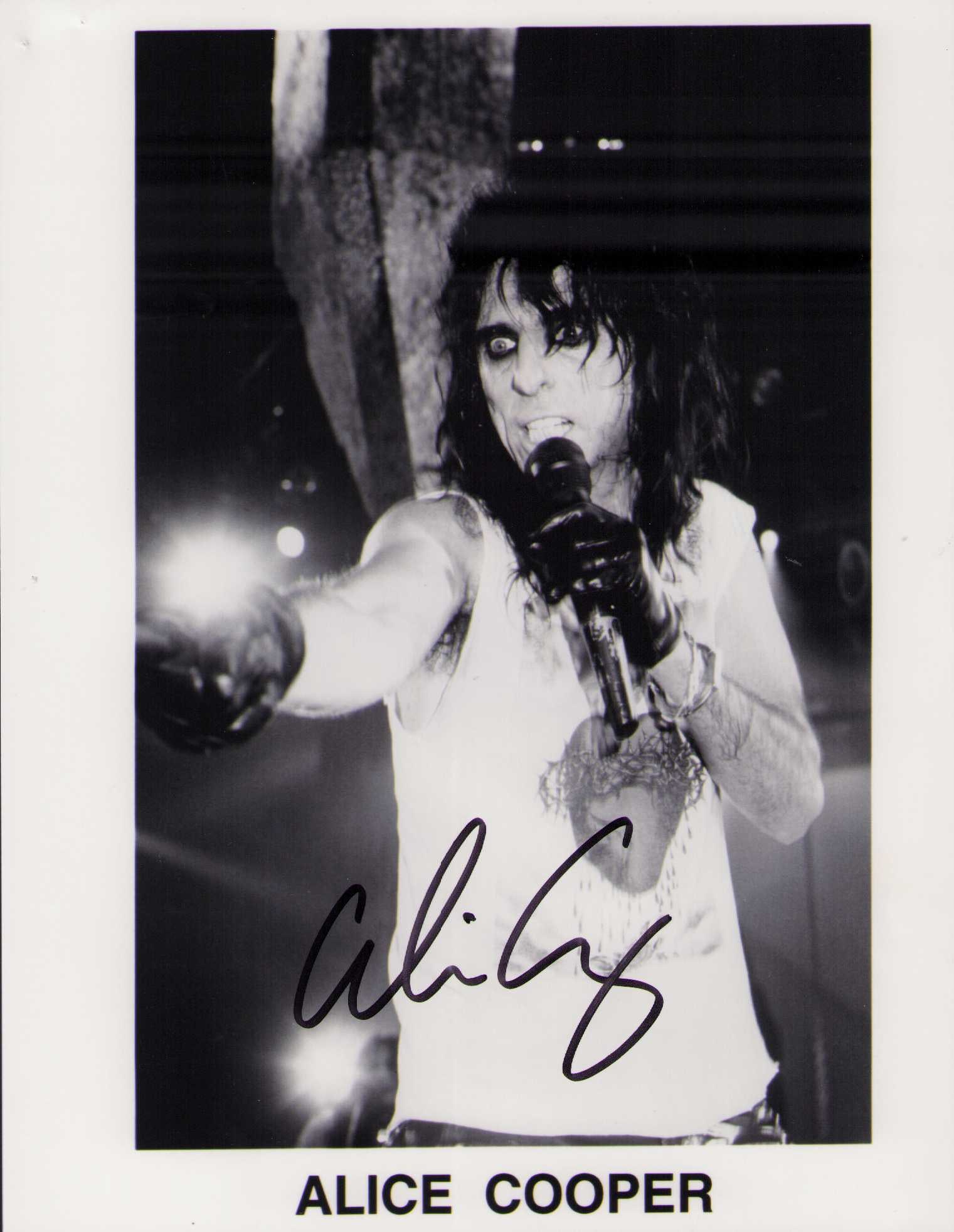 Alice Cooper signed photograph: A signed 8x10 by the rock legend of many hits Certificate of AuthenticityEVERY item in this auction comes with at minimum one fully illustrated and serial numbered COA signed by the leading