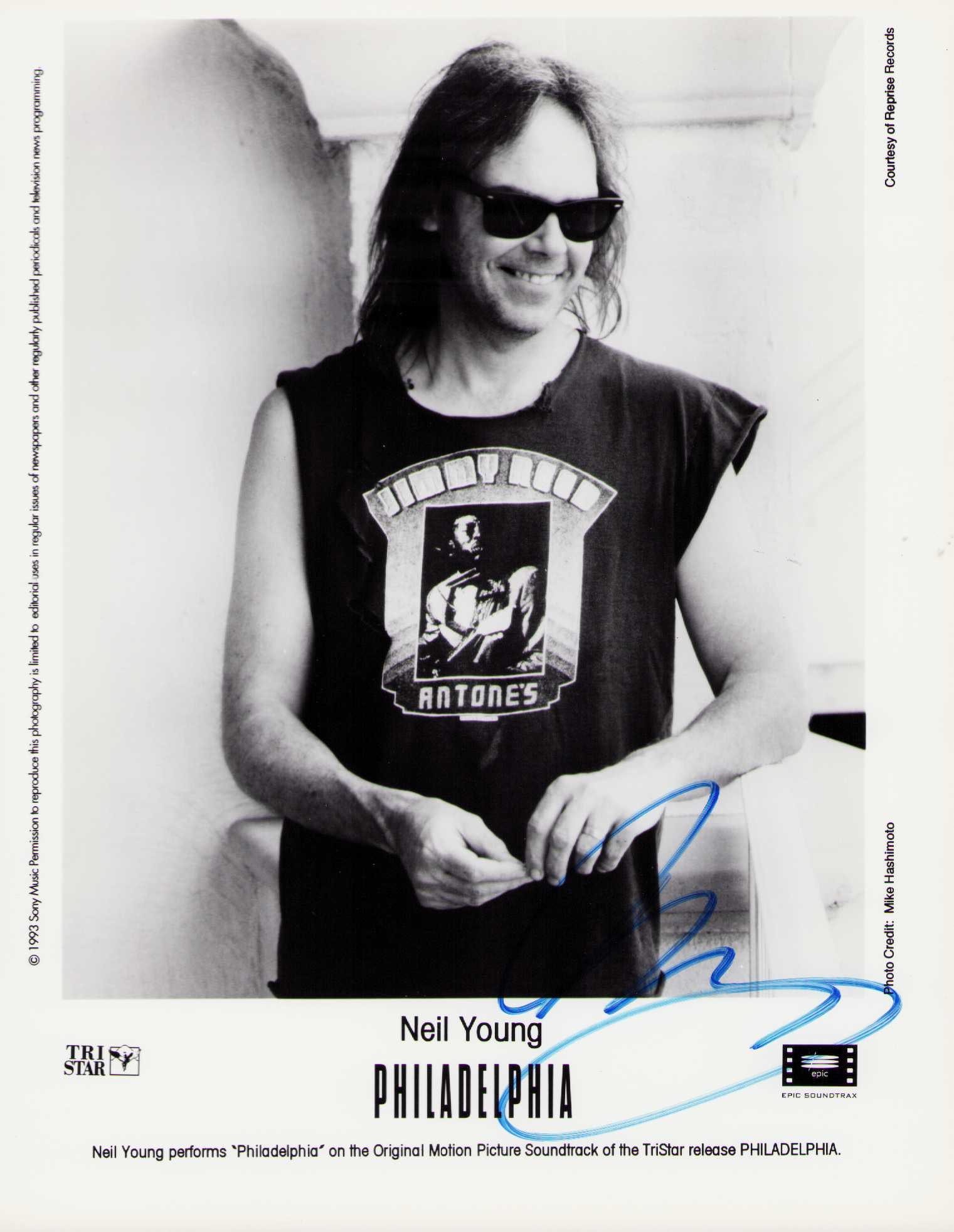 Neil Young signed photograph: A scarce vintage signed 8x10 of the famed singer songwriter Certificate of AuthenticityEVERY item in this auction comes with at minimum one fully illustrated and serial numbered COA signed by the lead