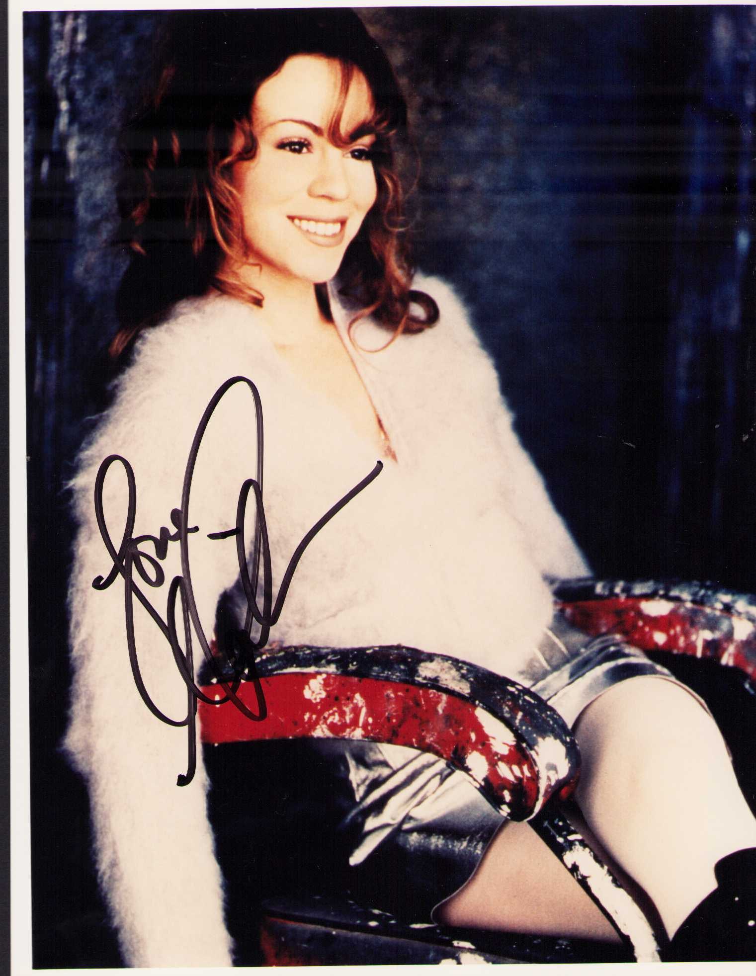 Mariah Carey signed photograph: A sexy signed 8x10 of the Pop Diva scarce signer Mariah Certificate of AuthenticityEVERY item in this auction comes with at minimum one fully illustrated and serial numbered COA signed by the leading 