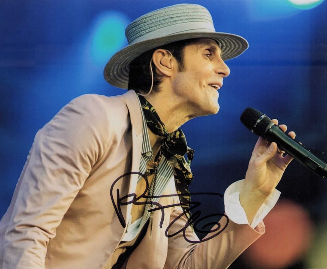 Perry Farrell signed photograph B: A solo shot at the microphone by the singer and lead to Porno for Pyros Certificate of AuthenticityEVERY item in this auction comes with at minimum one fully illustrated and serial numbered COA signed