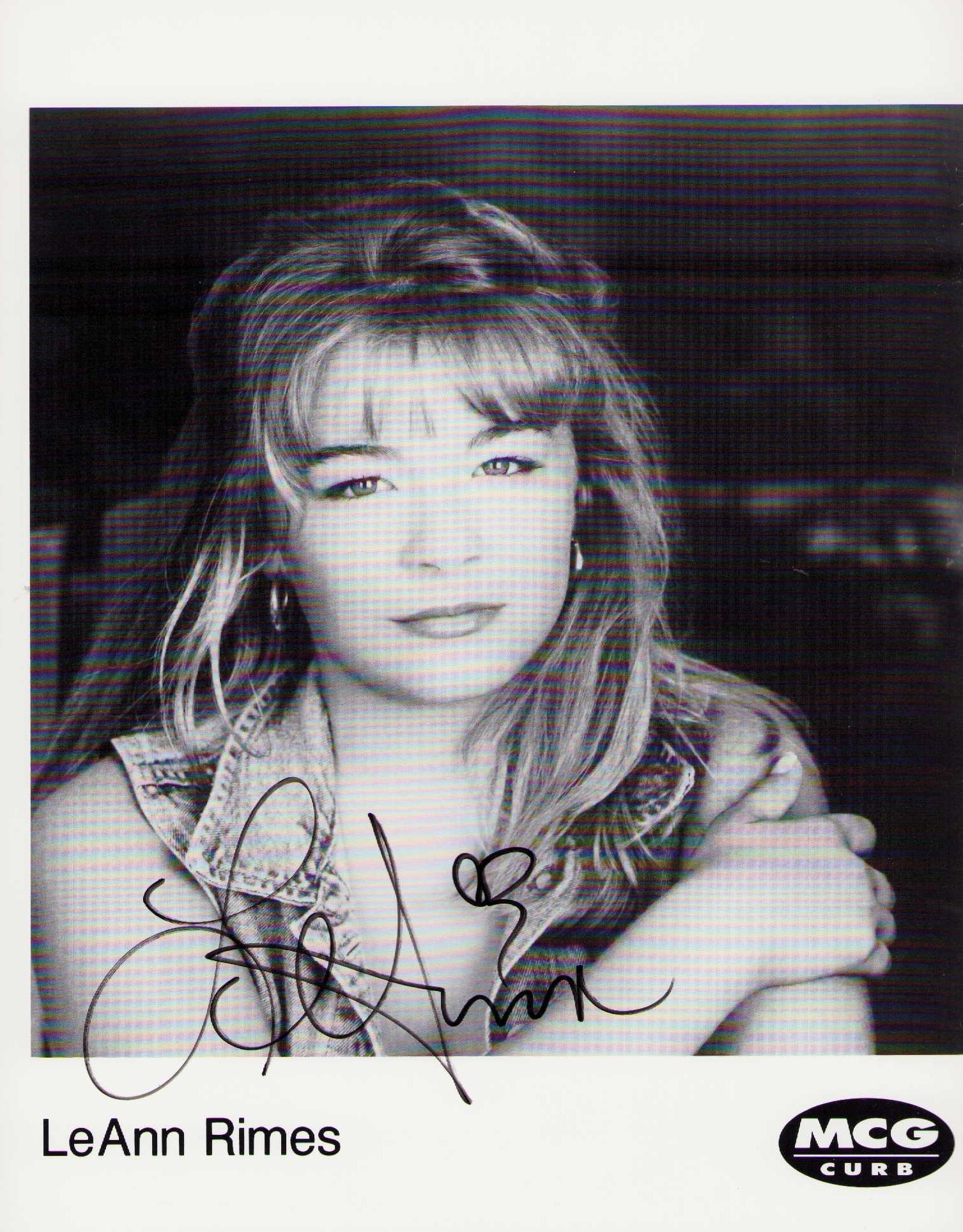 LeeAnn Rimes signed photograph: A vintage signed 8x10 of the country pop singer Certificate of AuthenticityEVERY item in this auction comes with at minimum one fully illustrated and serial numbered COA signed by the leading