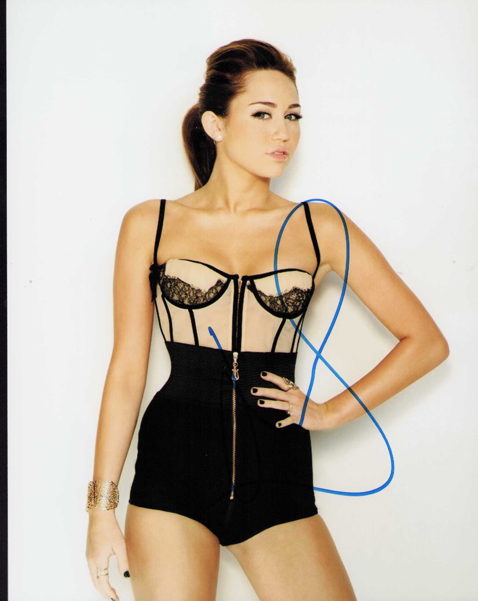 Miley Cyrus signed photograph: A sexy signed 8x10 of the pop legend and actress Certificate of AuthenticityEVERY item in this auction comes with at minimum one fully illustrated and serial numbered COA signed by the leading