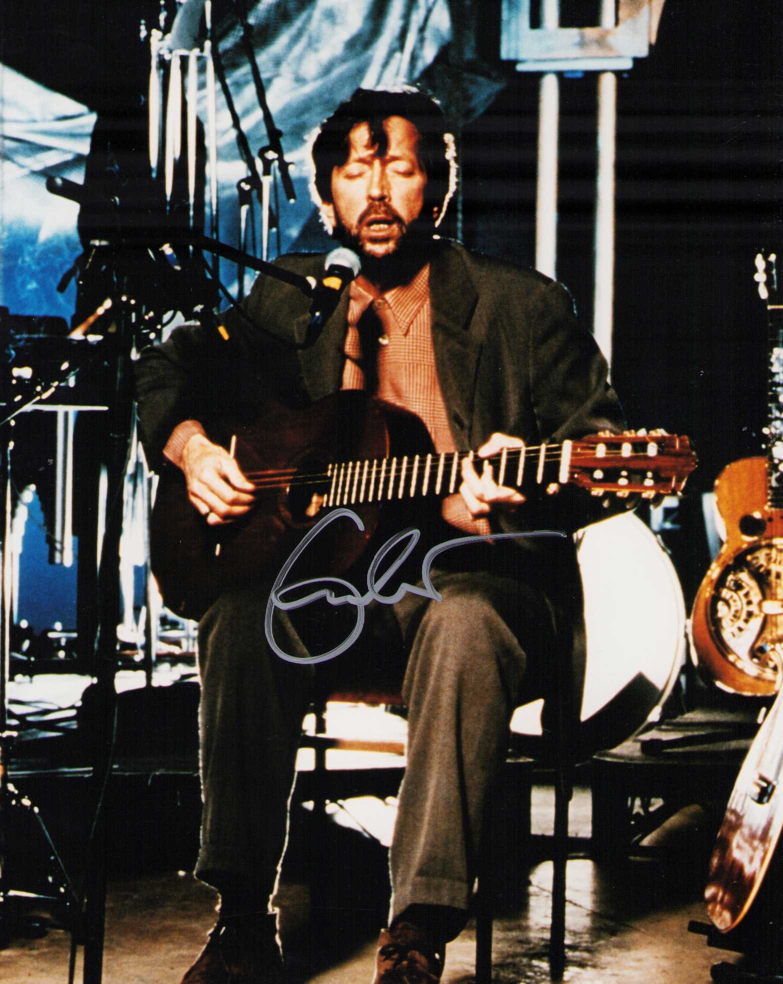 Eric Clapton signed photograph: Scarce signer Slow Hand legend Eric Clapton signed 8x10 photograph Certificate of AuthenticityEVERY item in this auction comes with at minimum one fully illustrated and serial numbered COA signed by t